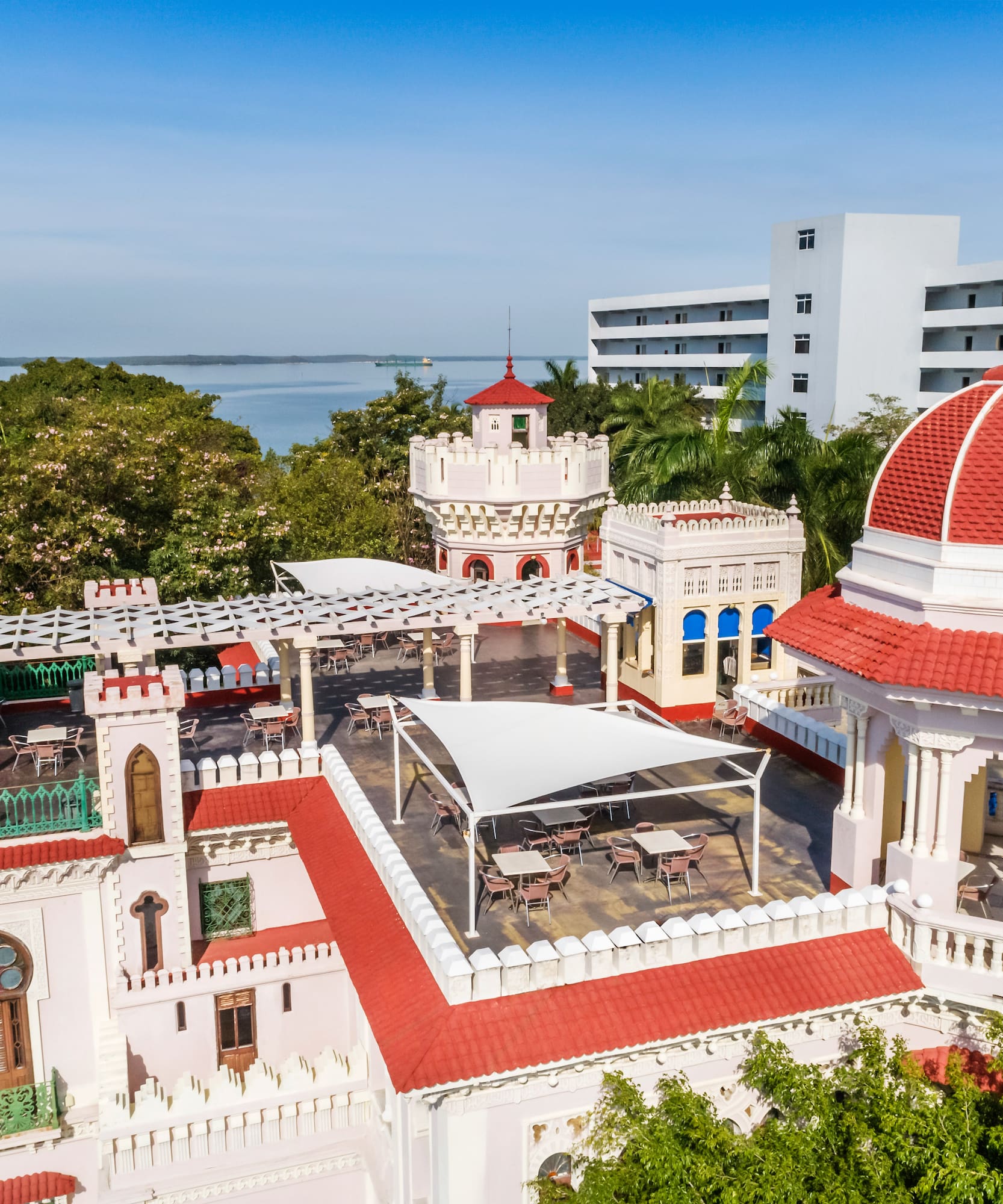 a building with a red roof and a dome
