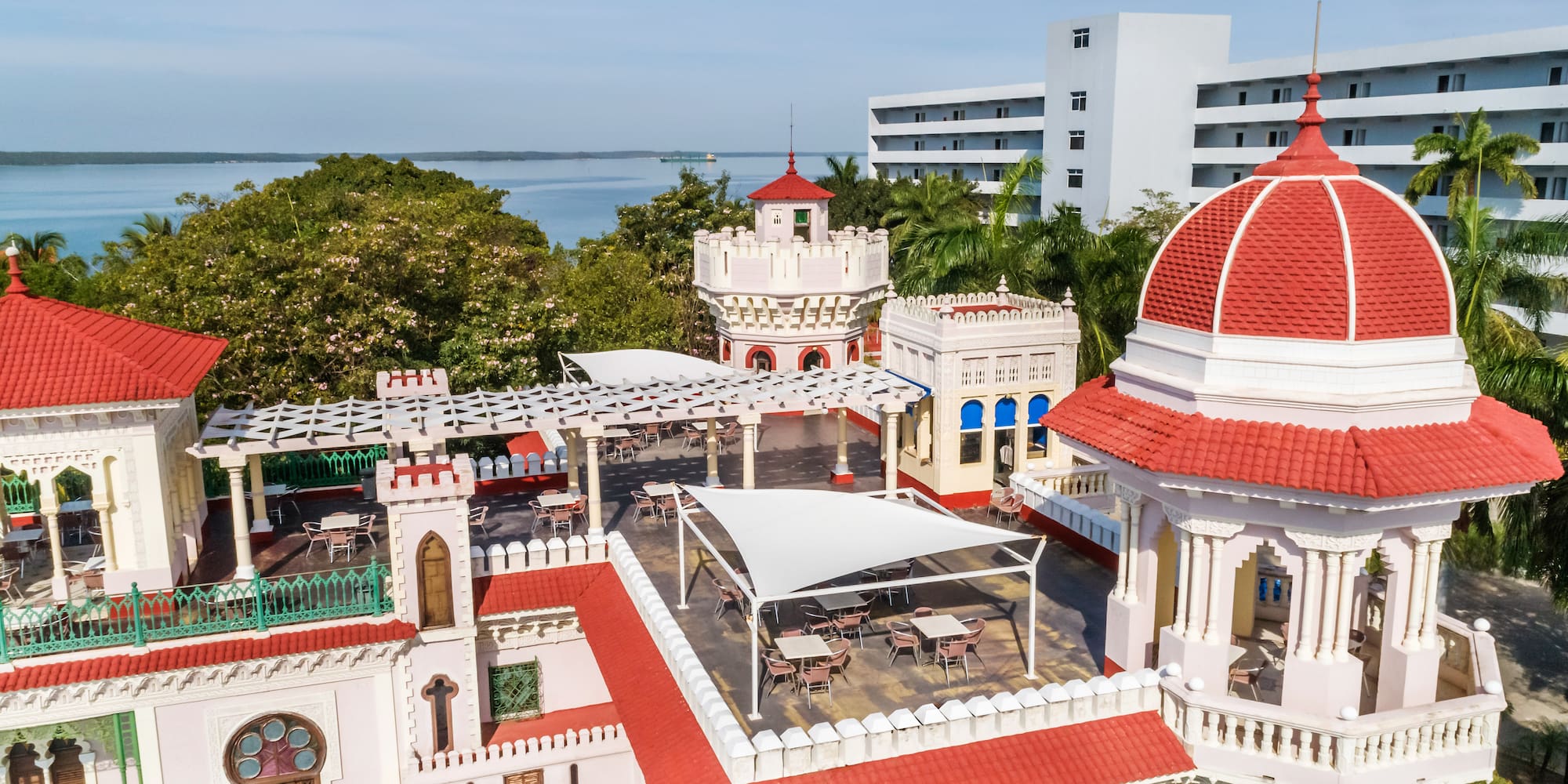 a building with a red roof and a dome
