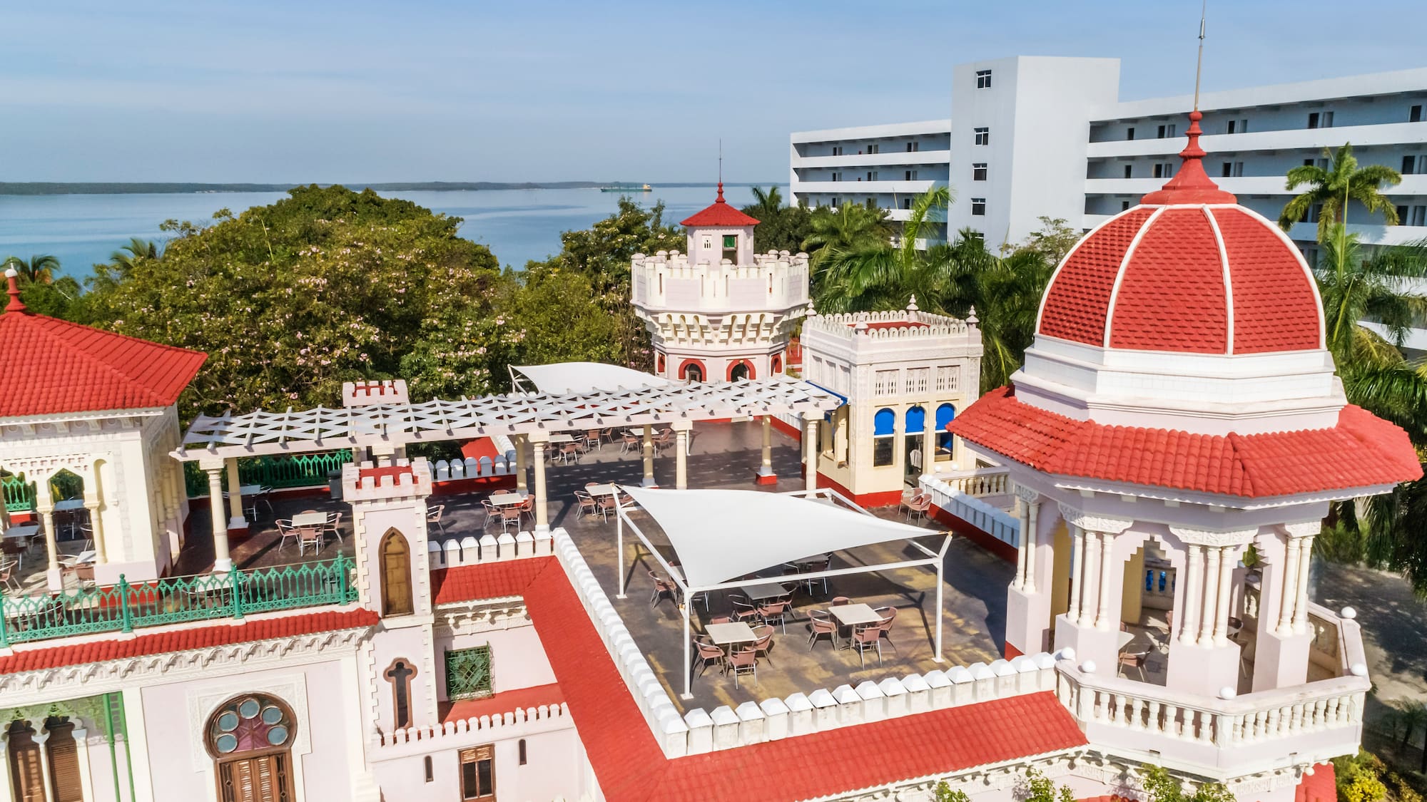 a building with a red roof and a dome