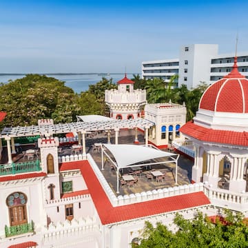 a building with a red roof and a dome