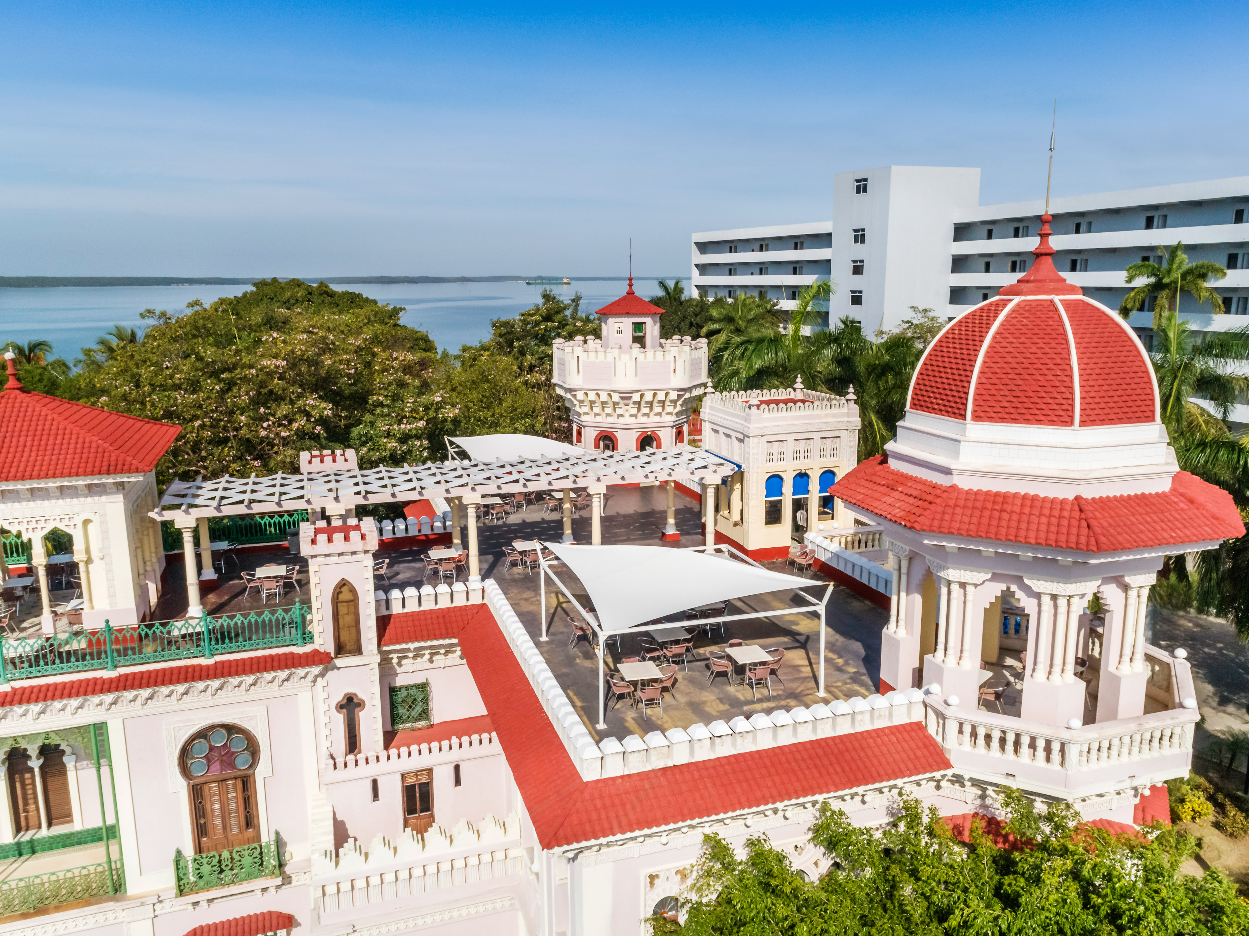 a building with a red roof and a dome