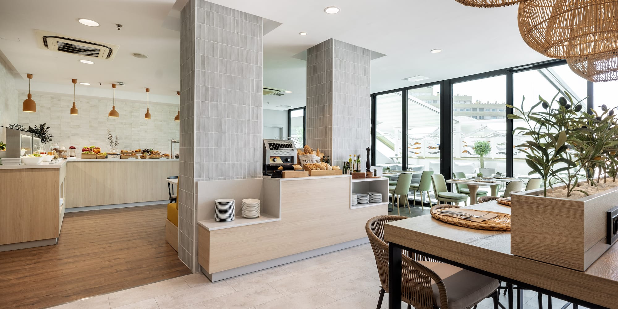 a restaurant with a large counter and chairs