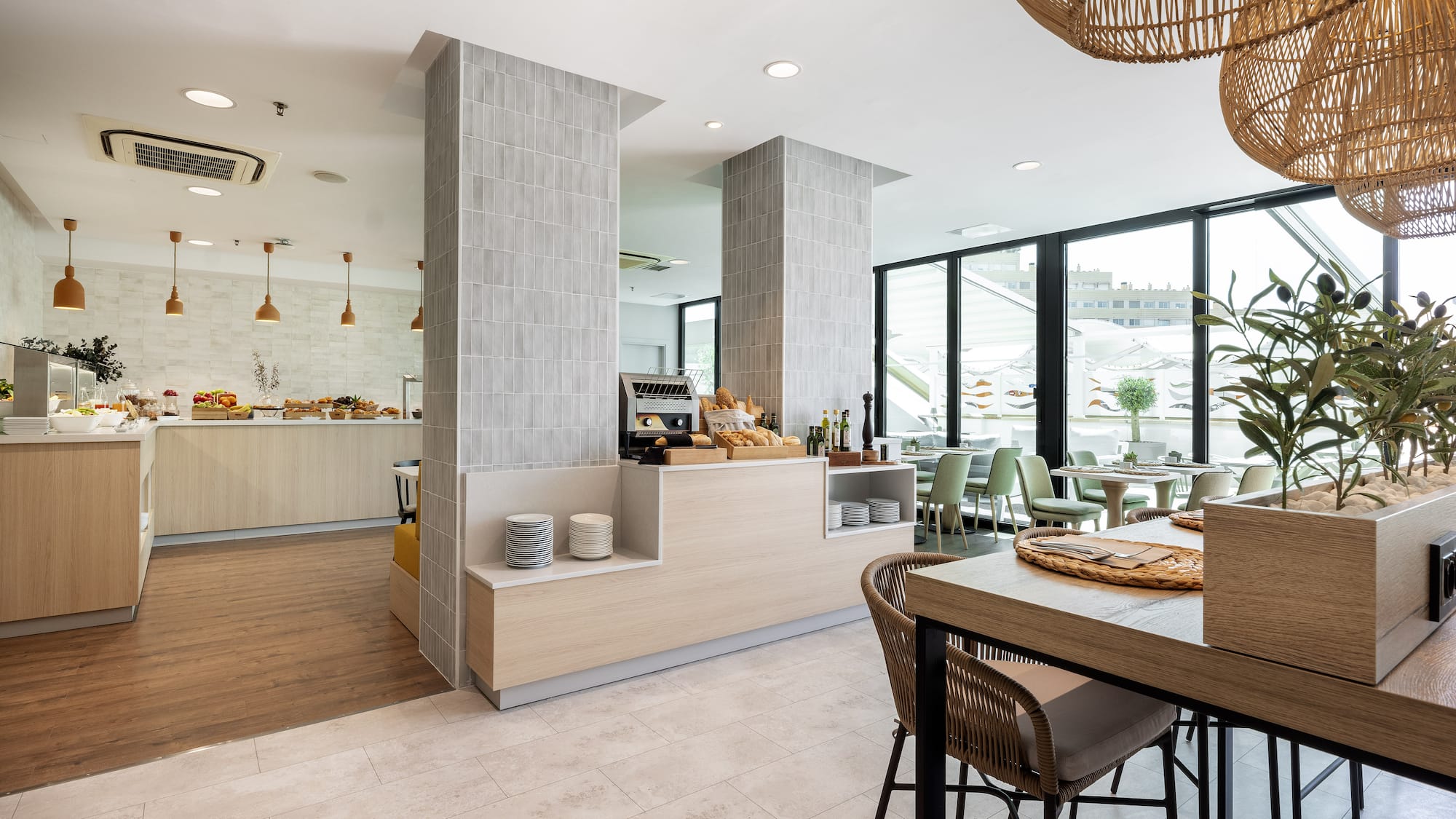 a restaurant with a large counter and chairs