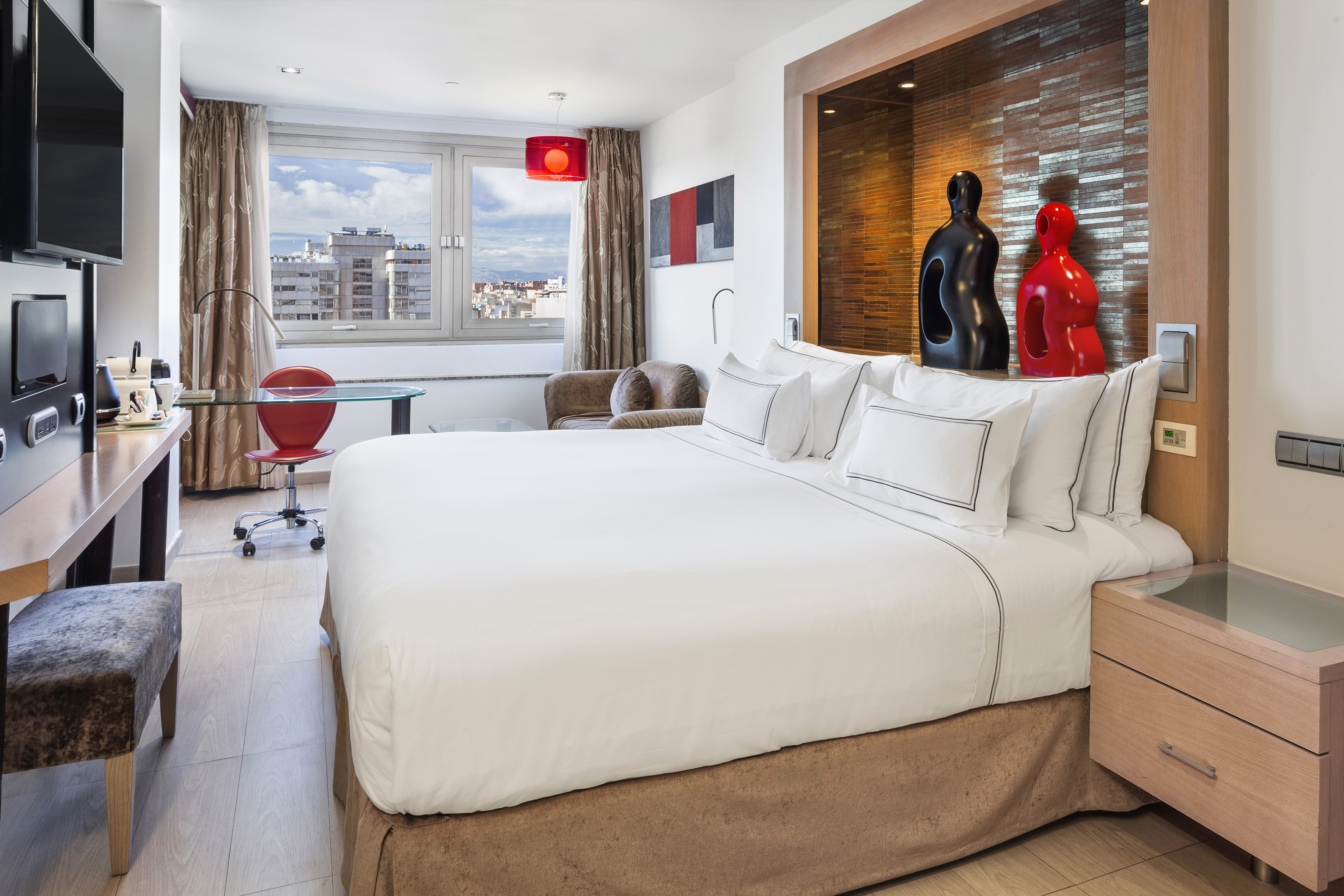 a bedroom with a bed and a table