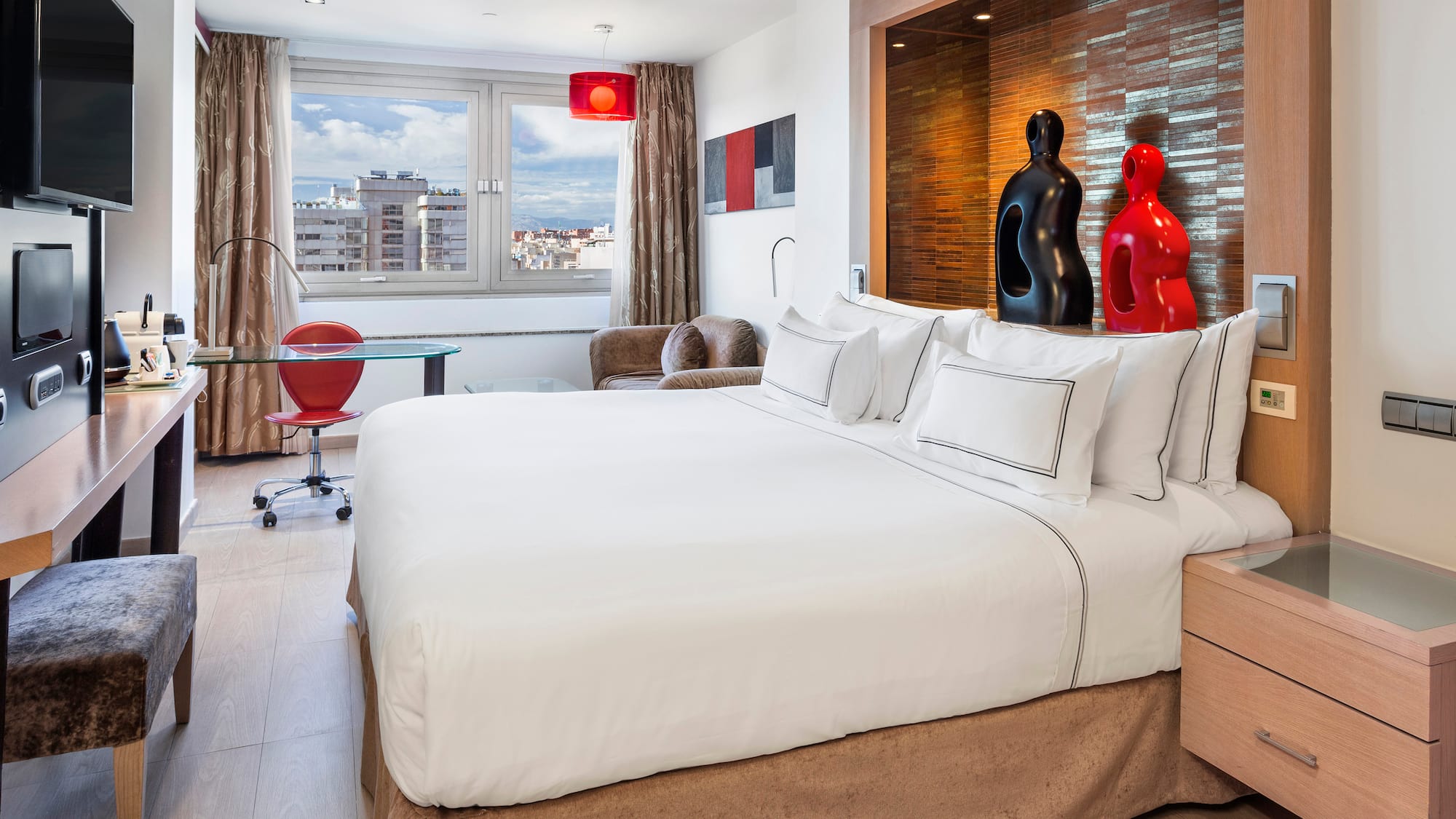 a bedroom with a bed and a table