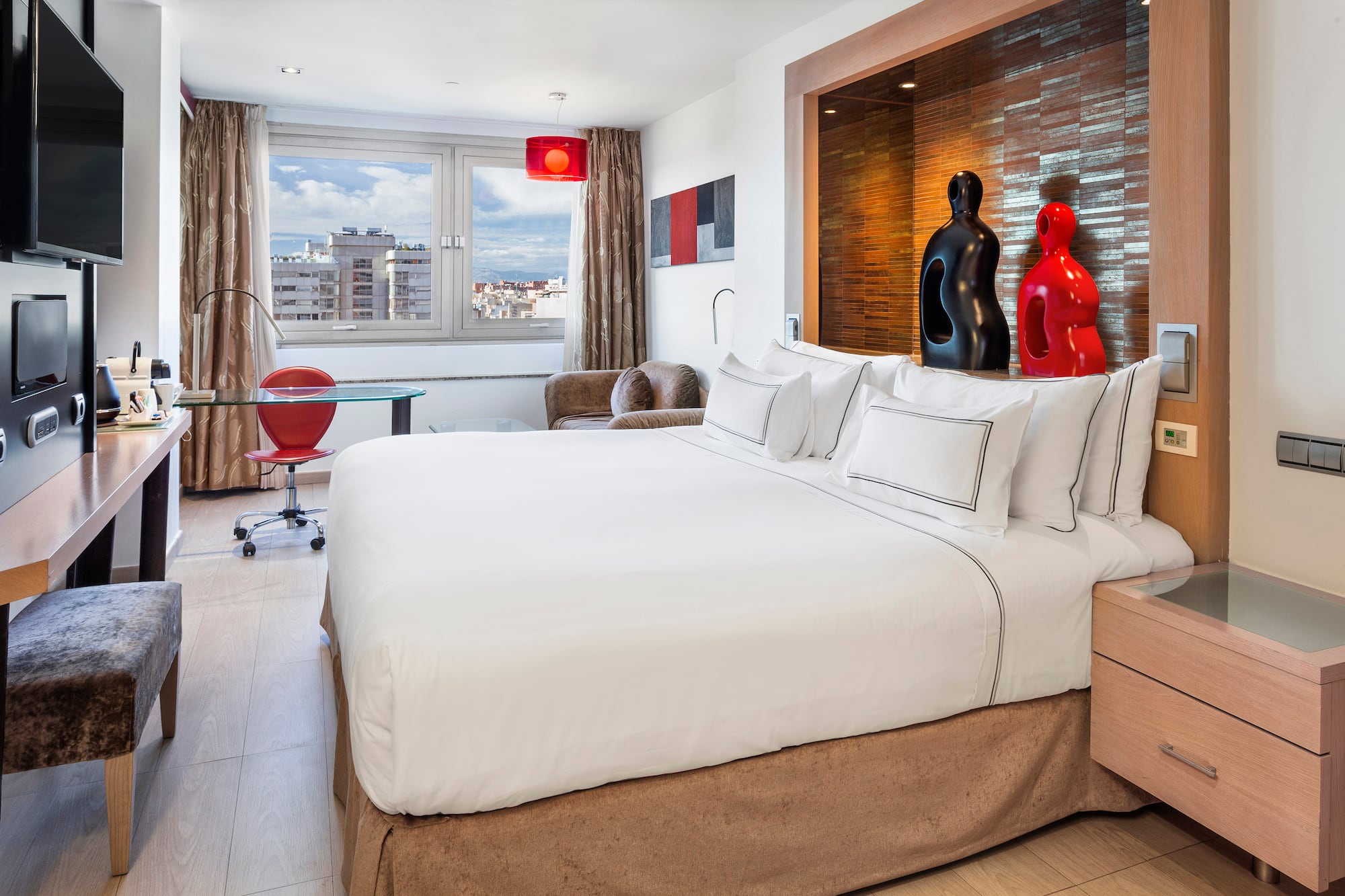 a bedroom with a bed and a table