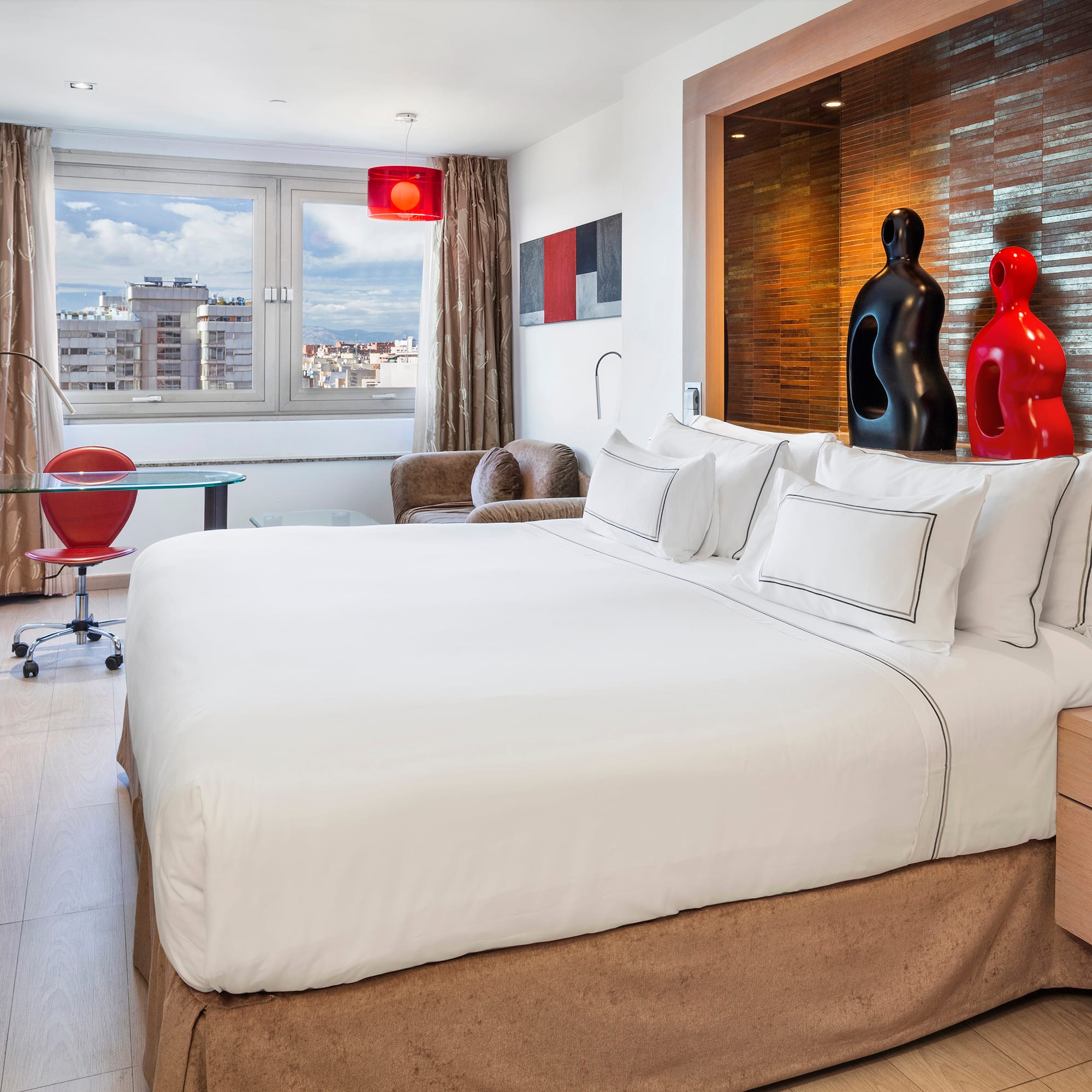 a bedroom with a bed and a table