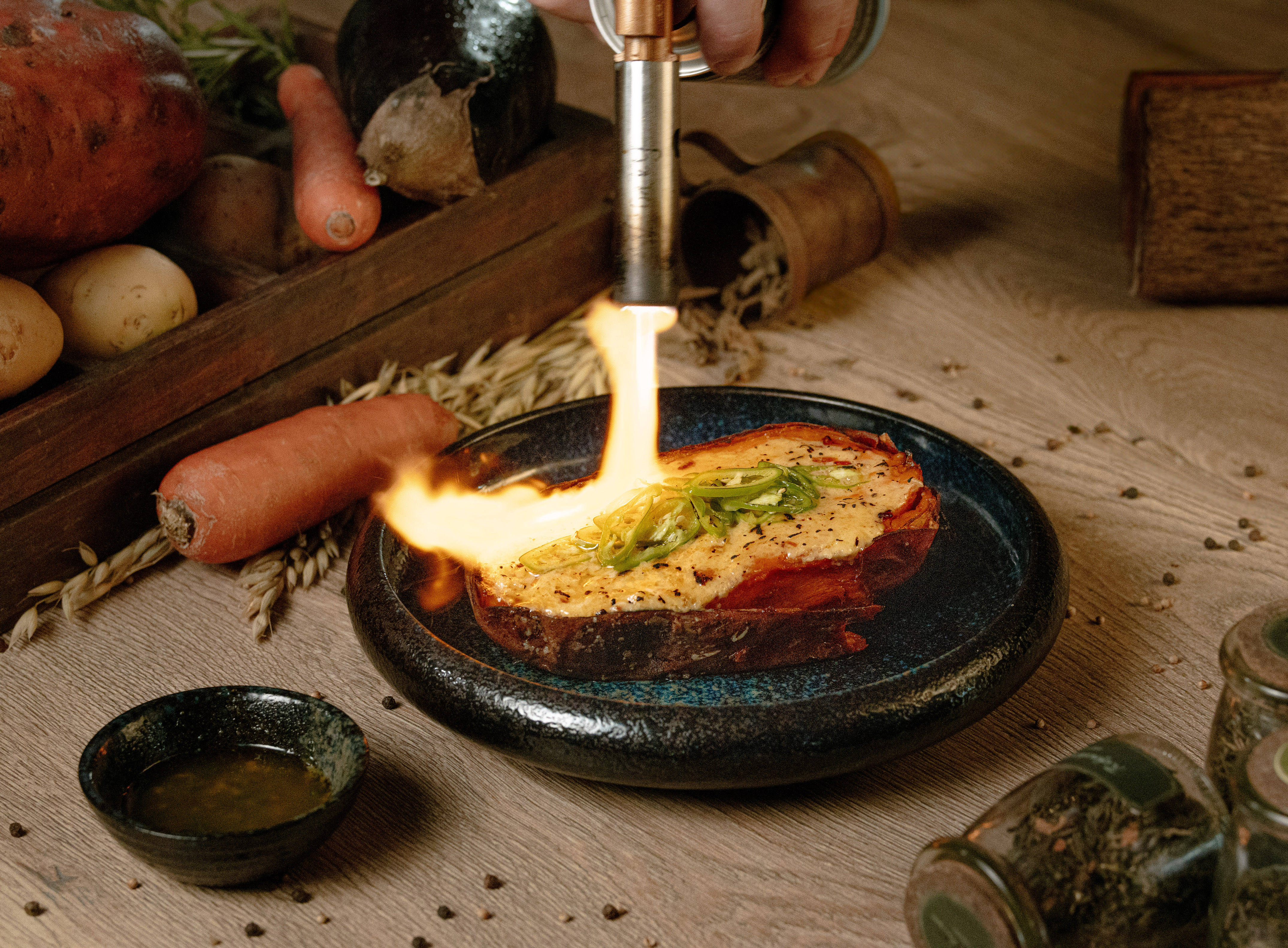 a person lighting up food on a plate