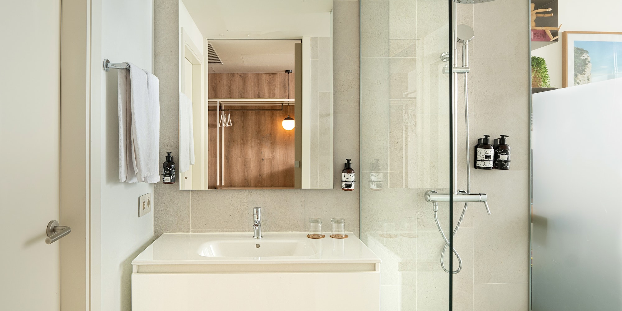 a bathroom with a shower and sink