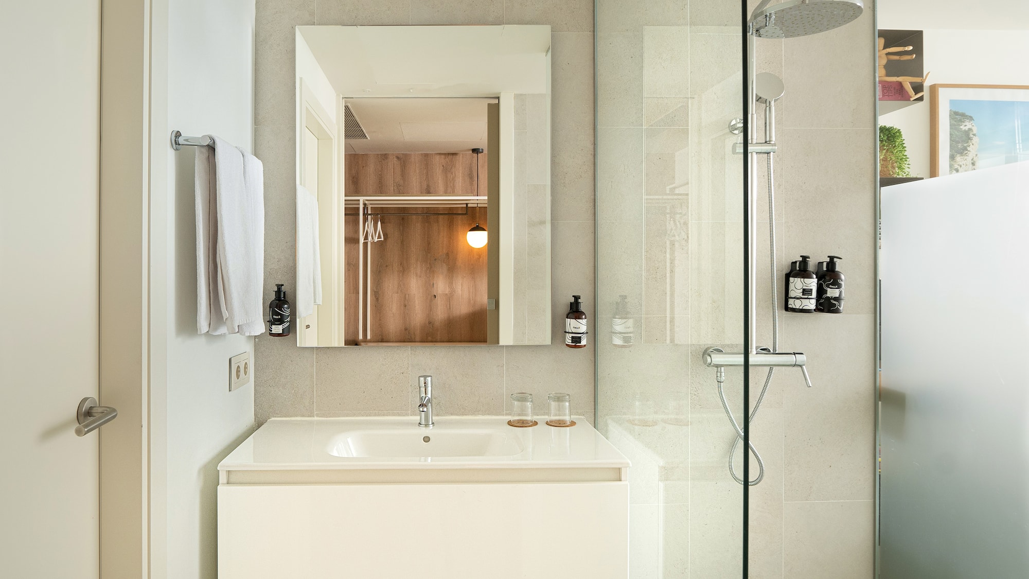 a bathroom with a shower and sink