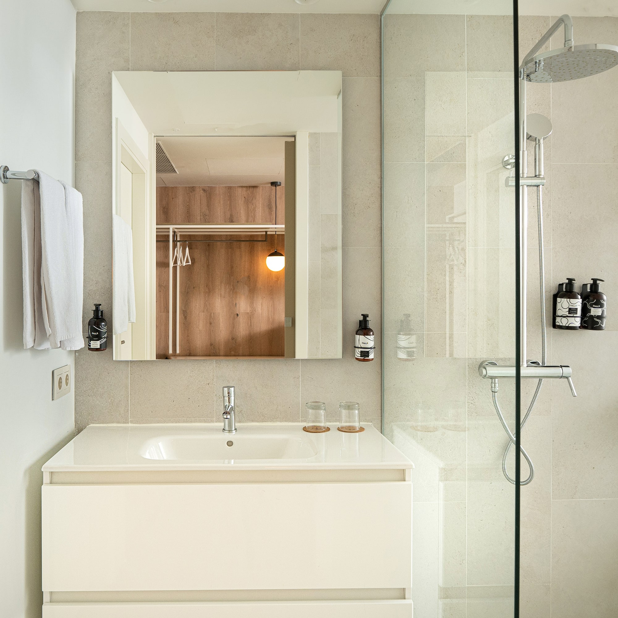 a bathroom with a shower and sink