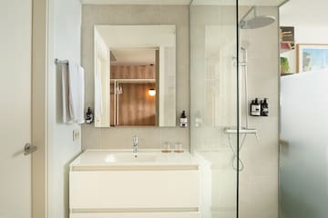 a bathroom with a shower and sink