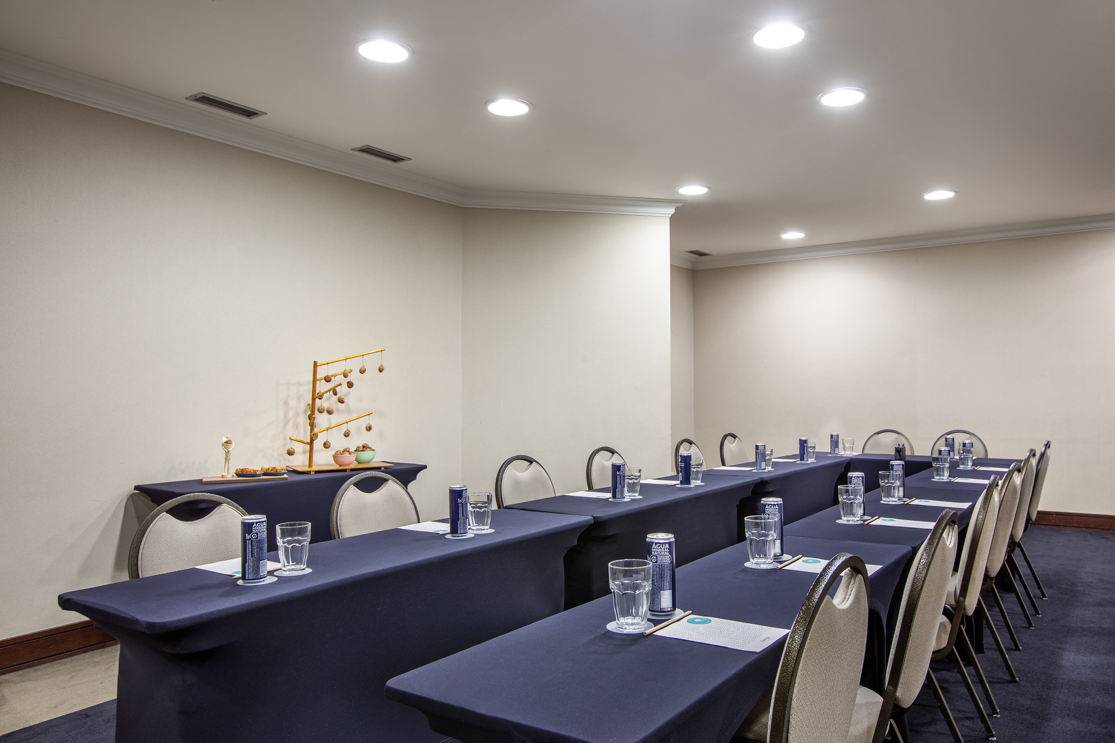 U-shaped conference room setup for a corporate business meeting.