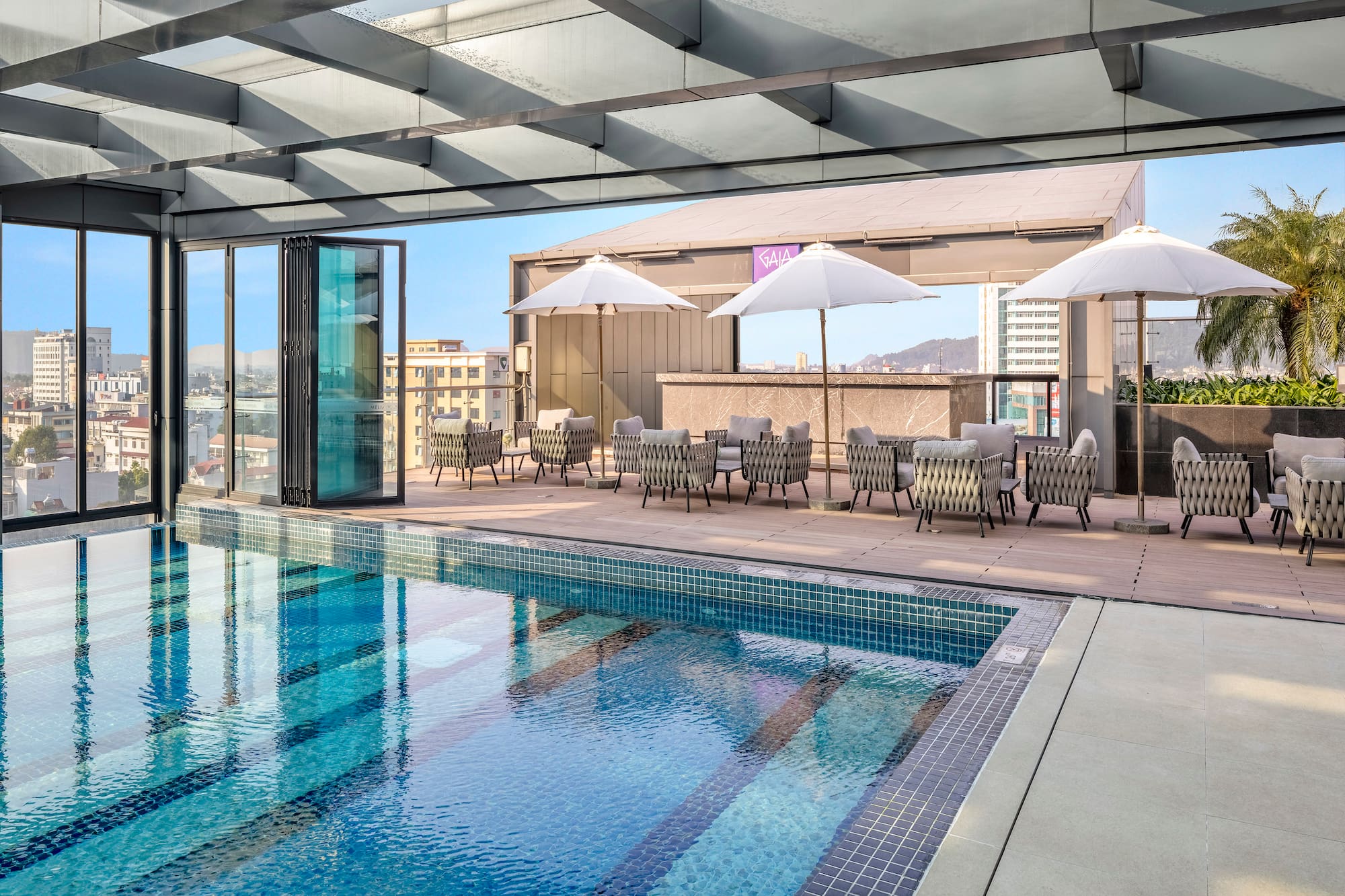 a pool with chairs and umbrellas