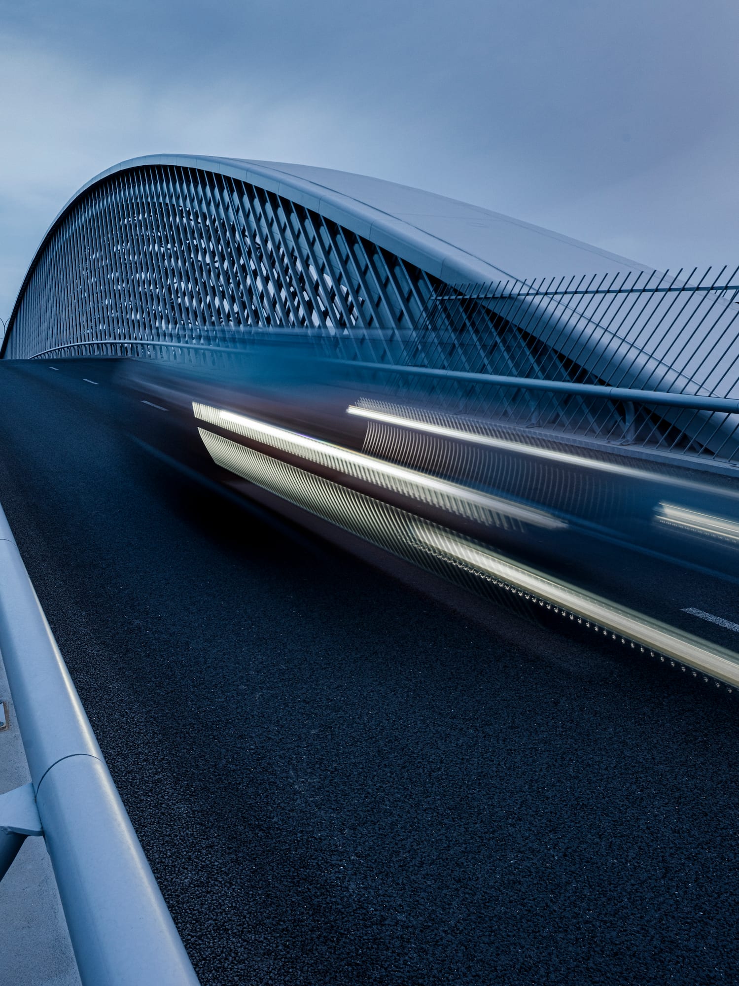a bridge with a car moving on it