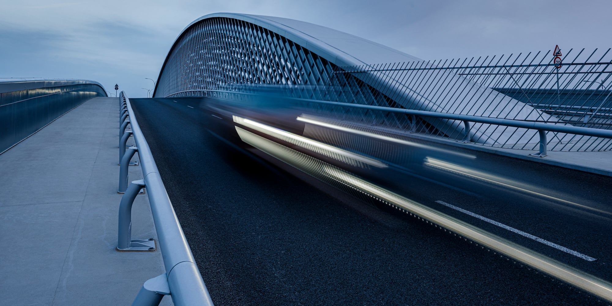 a bridge with a car moving on it