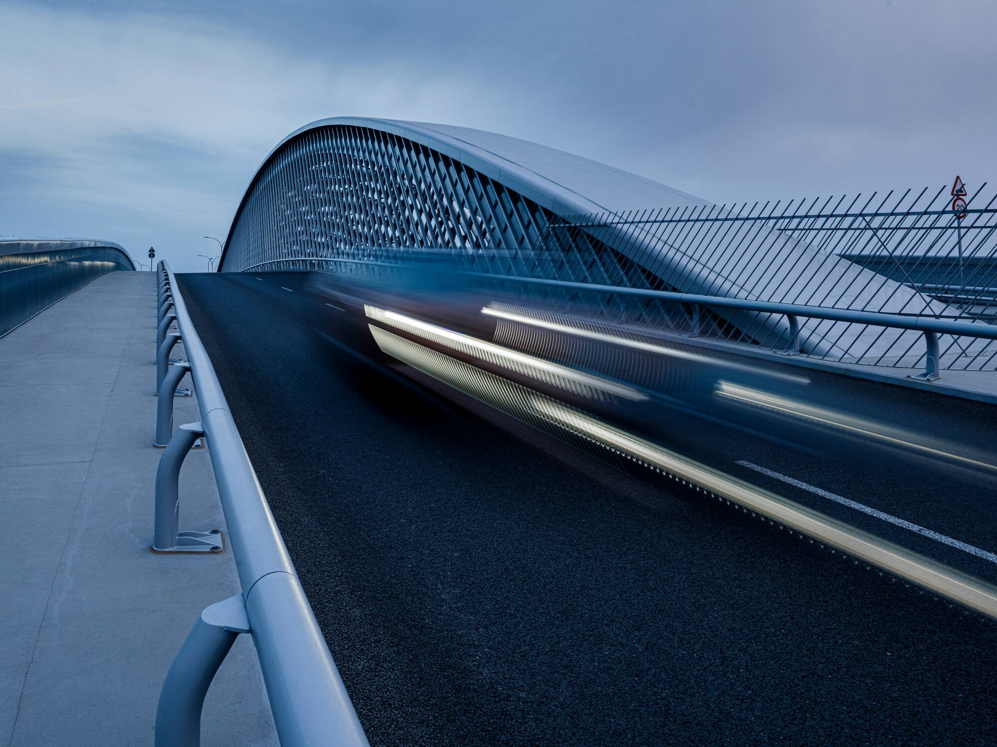 a bridge with a car moving on it