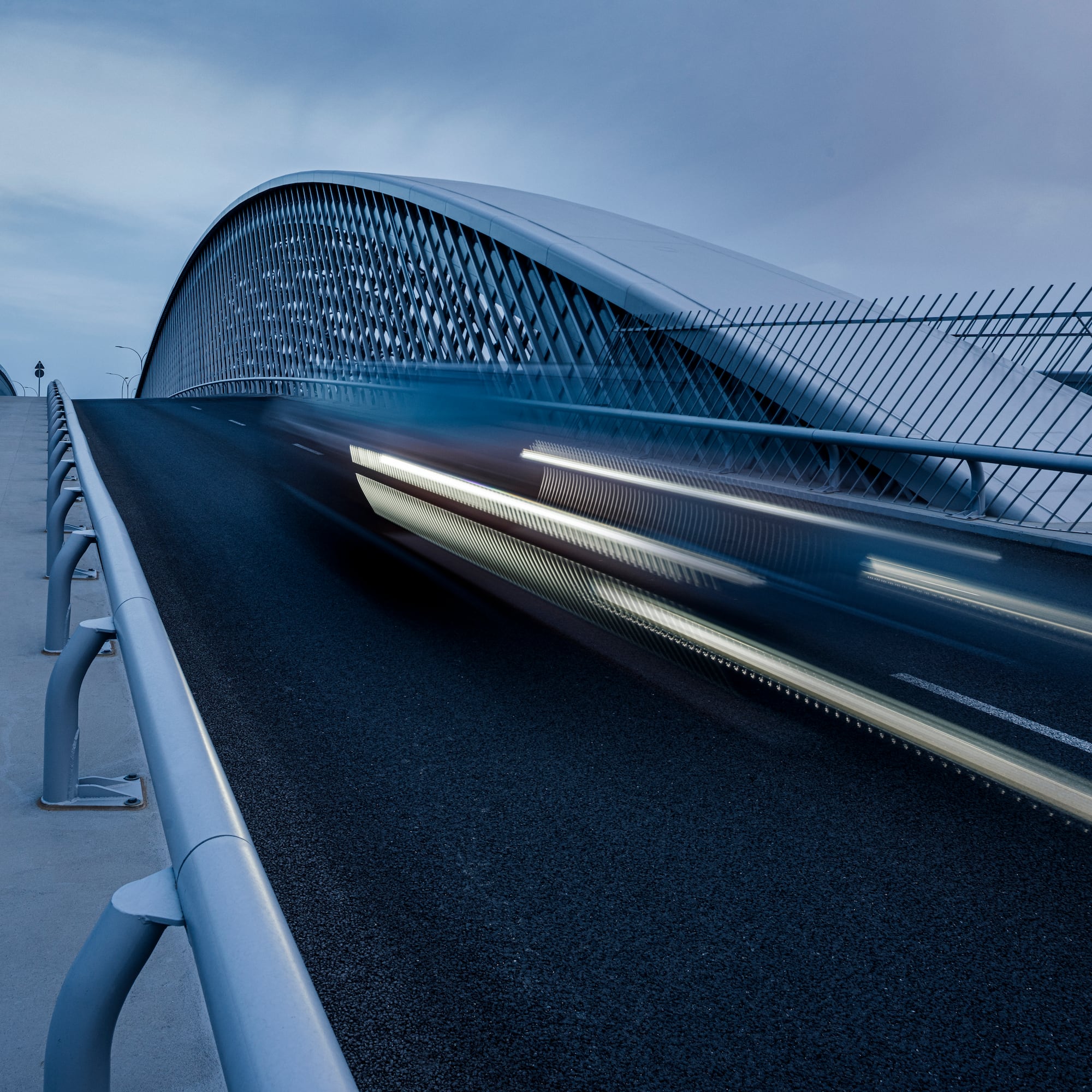 a bridge with a car moving on it