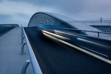 a bridge with a car moving on it