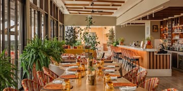 a restaurant with tables and chairs