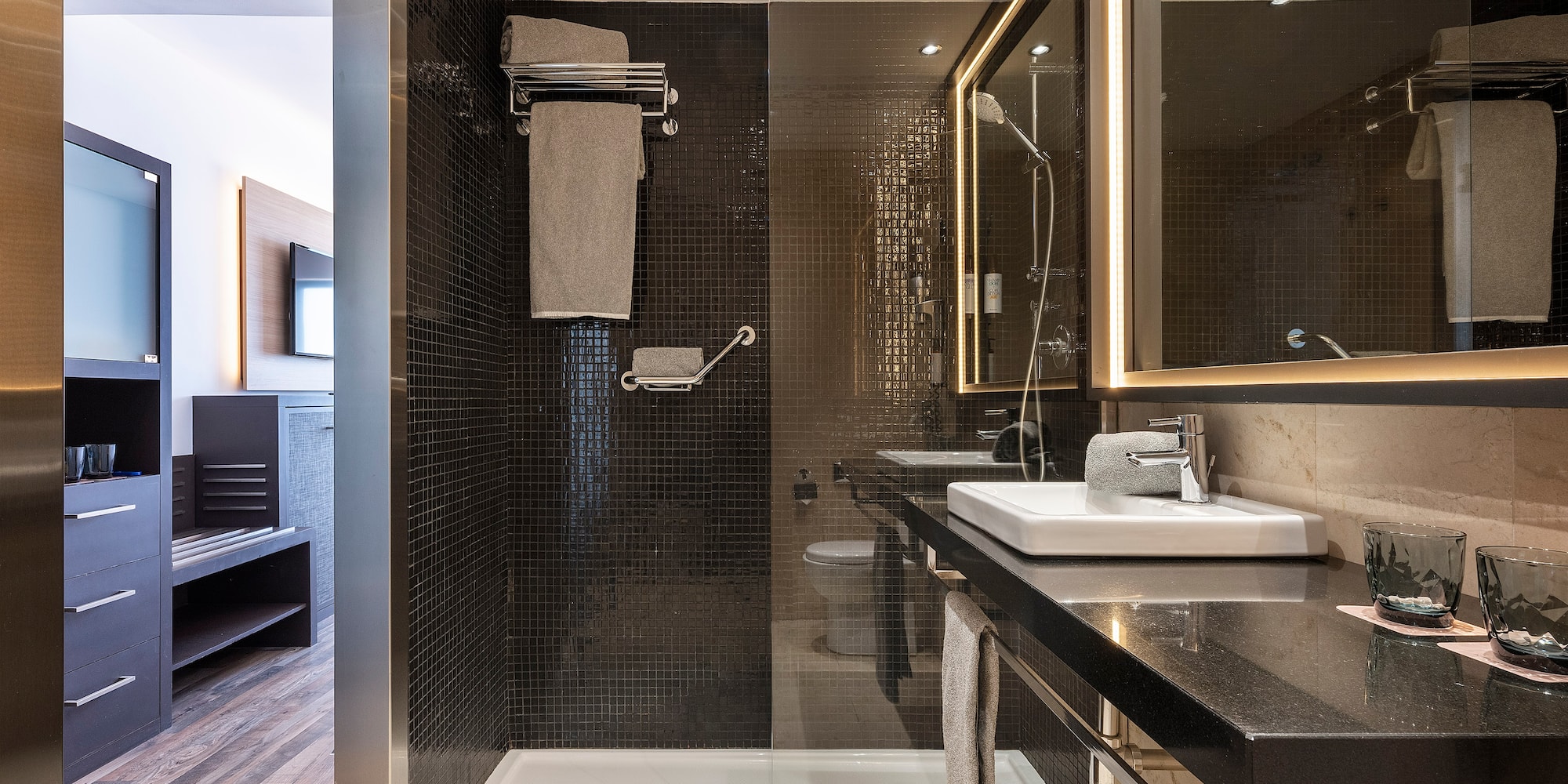 a bathroom with a shower and sink