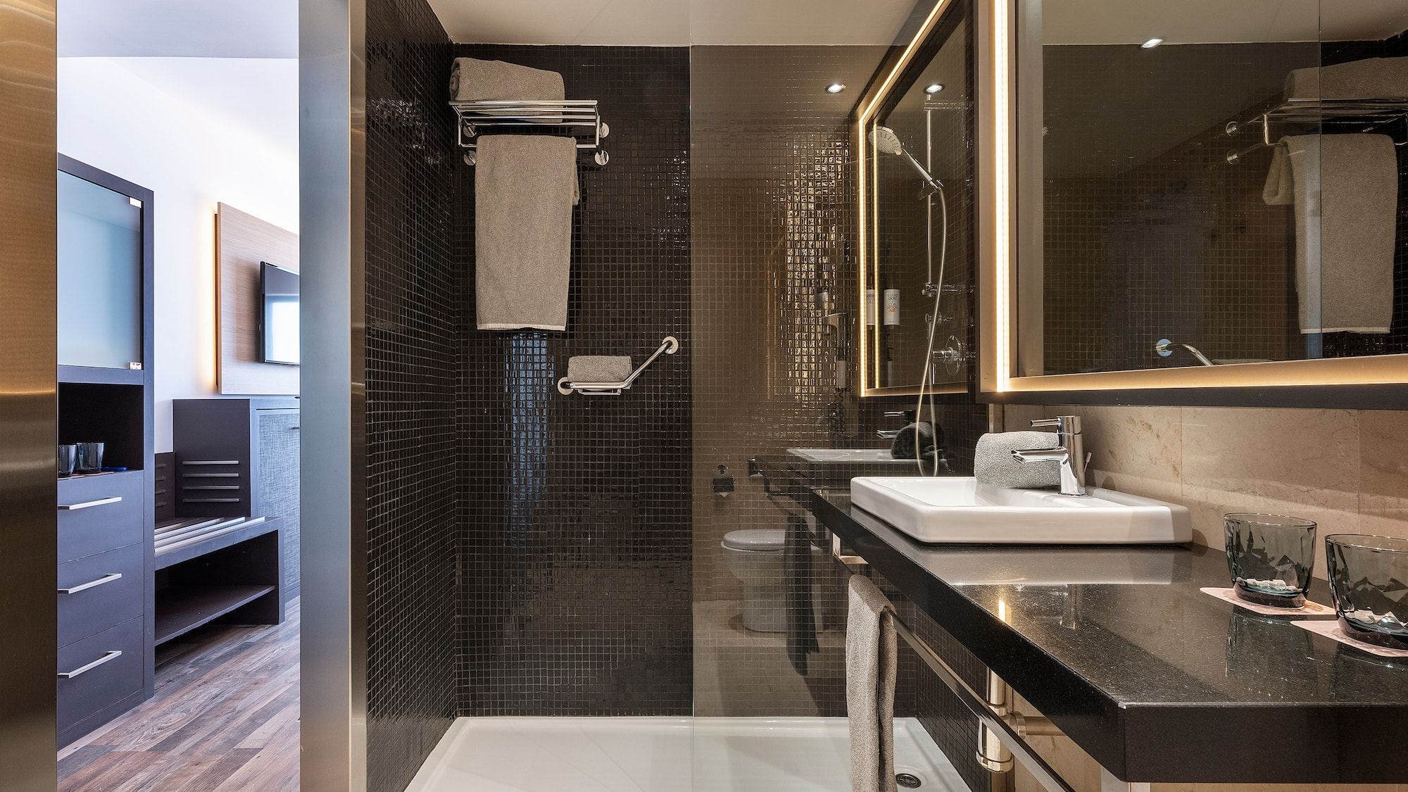 a bathroom with a shower and sink