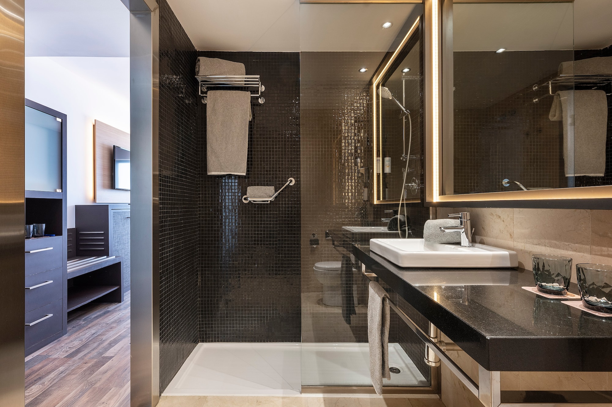 a bathroom with a shower and sink