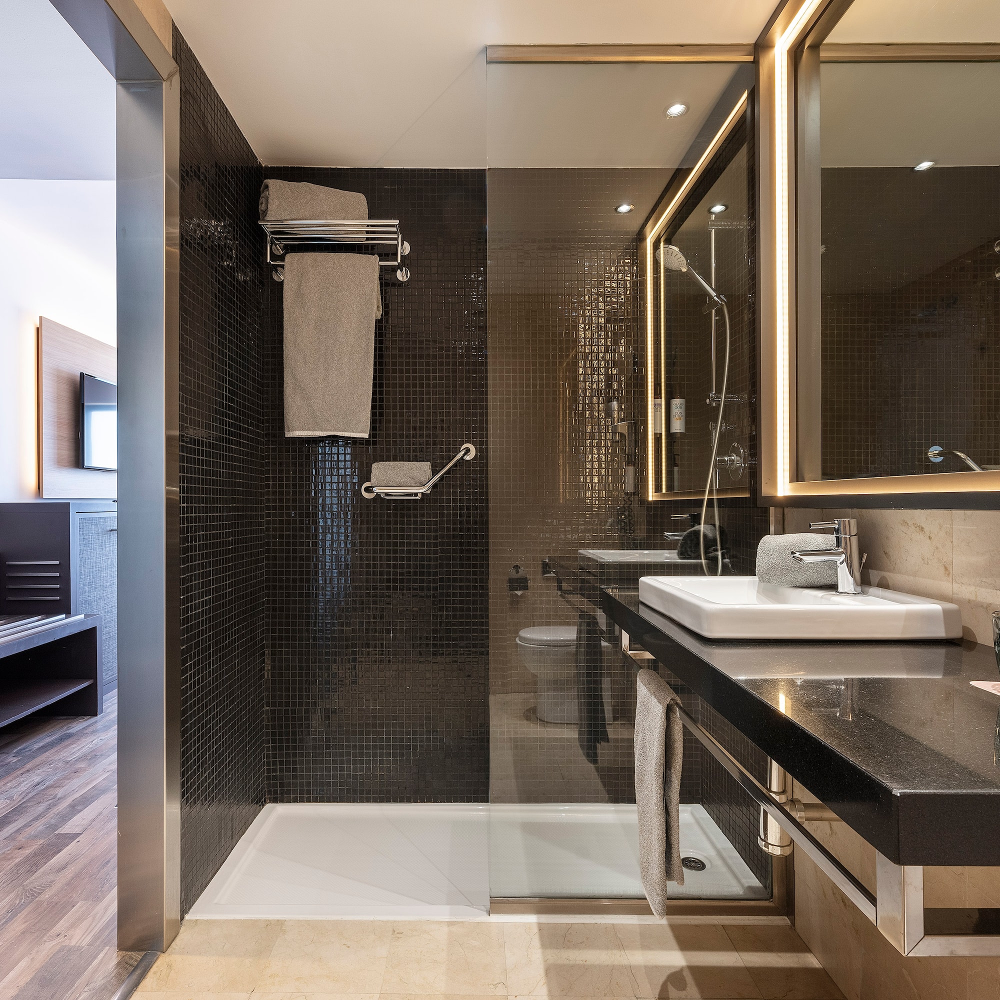 a bathroom with a shower and sink