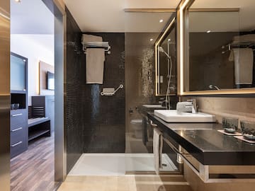 a bathroom with a shower and sink