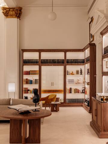 a room with a book shelf and a couch