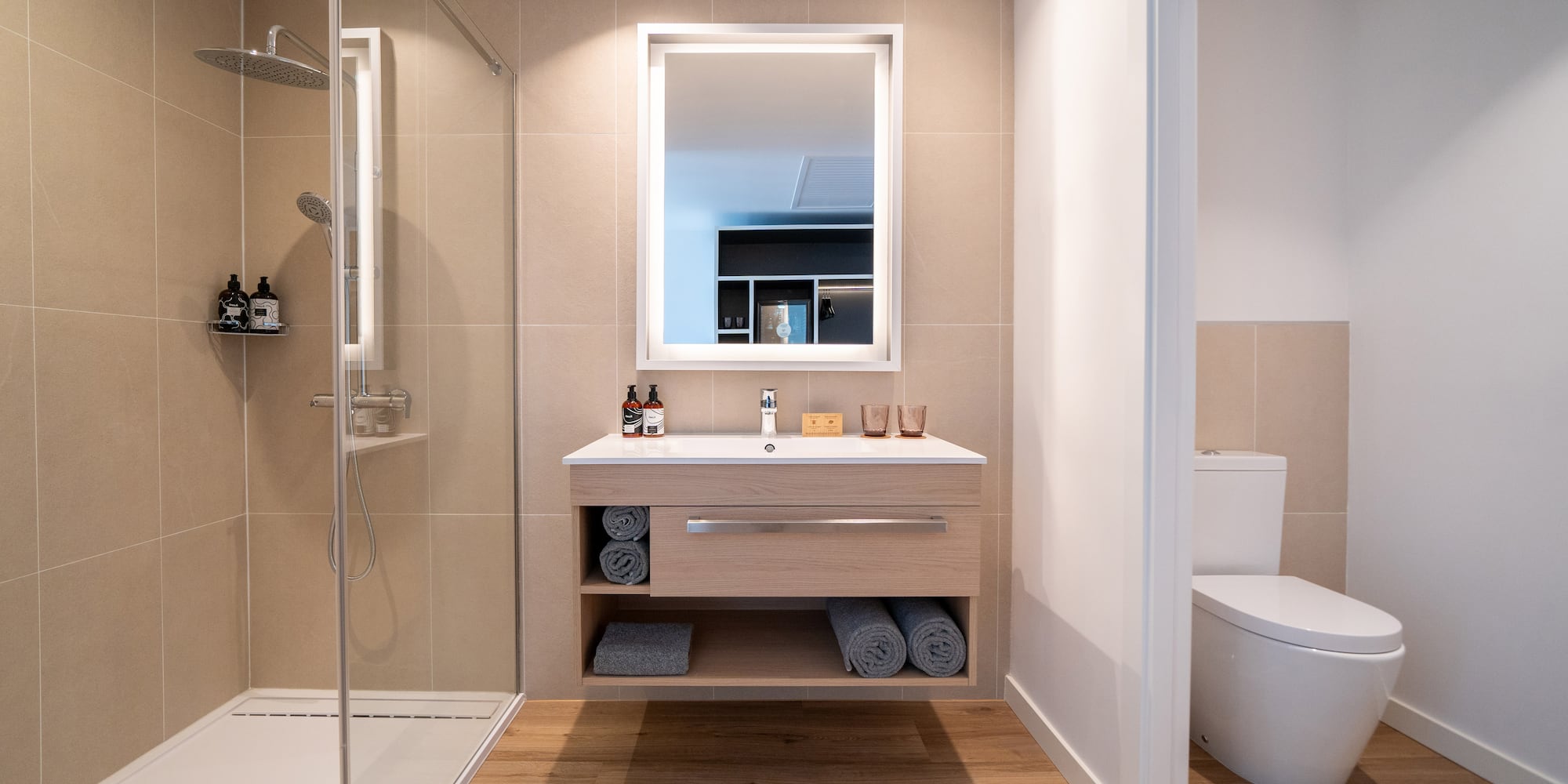 a bathroom with a shower and a sink
