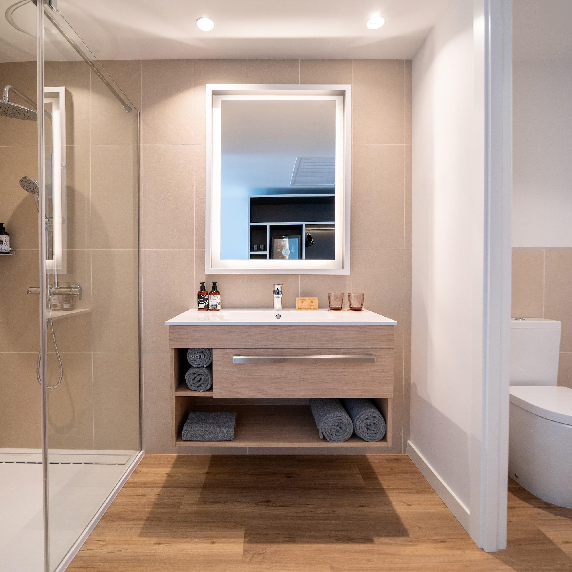 a bathroom with a shower and a sink