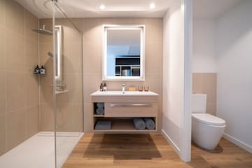 a bathroom with a shower and a sink