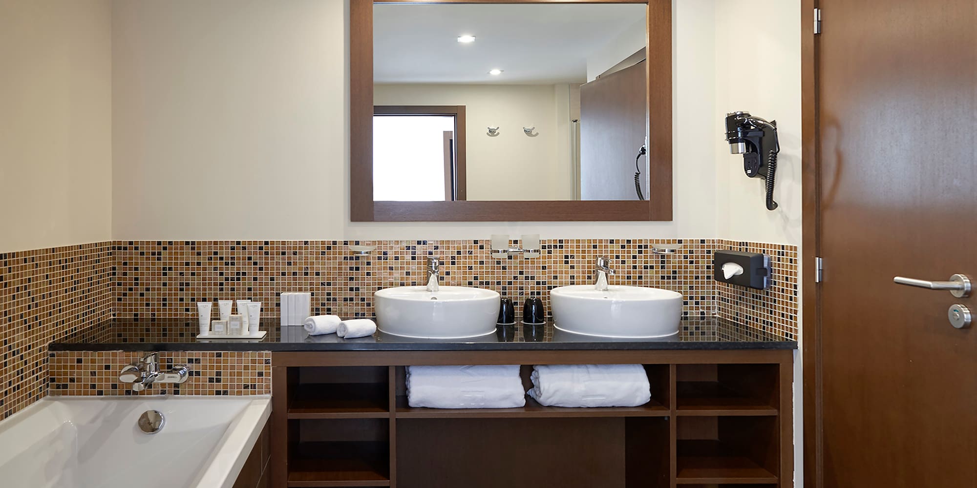 a bathroom with a mirror and sinks