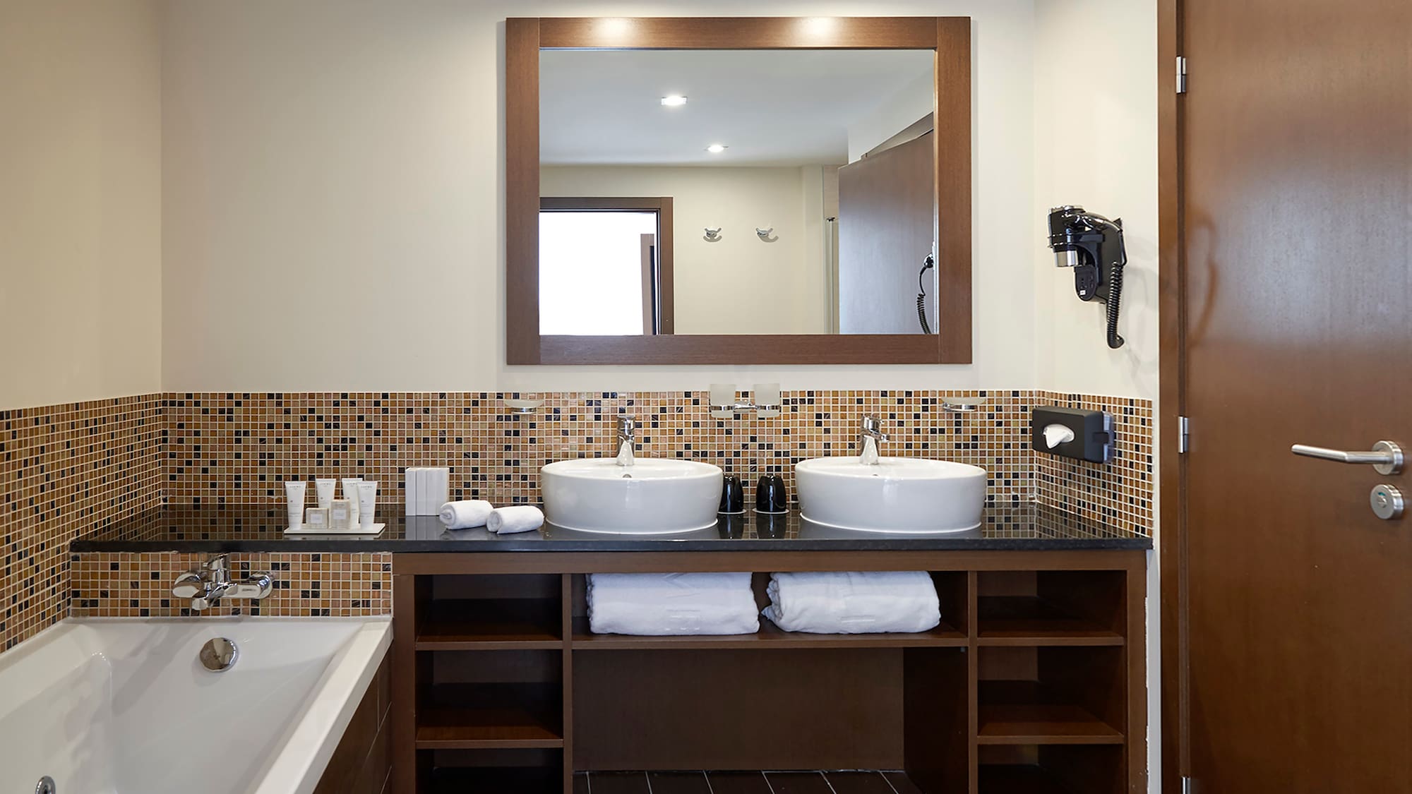 a bathroom with a mirror and sinks