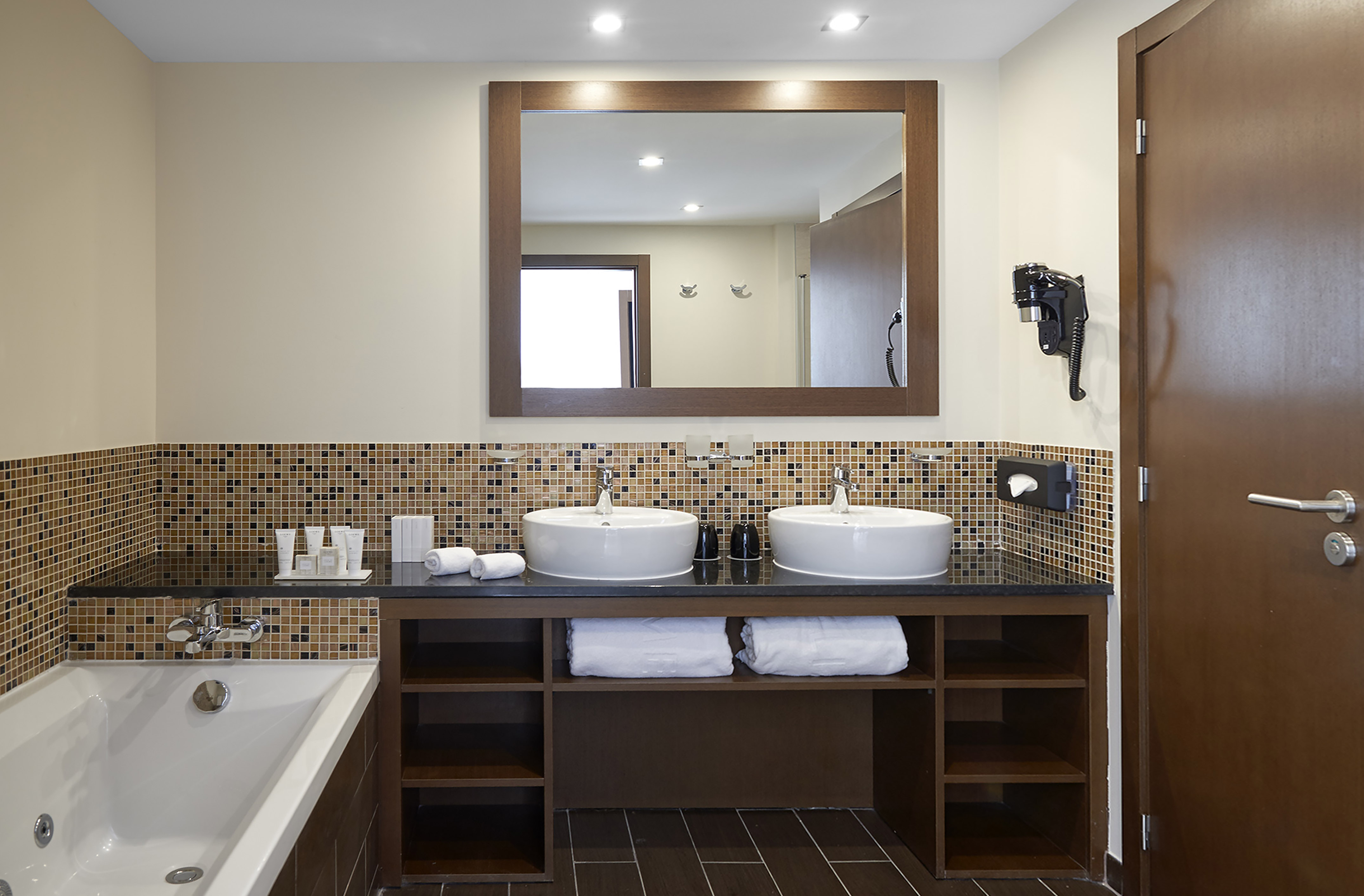 a bathroom with a mirror and sinks