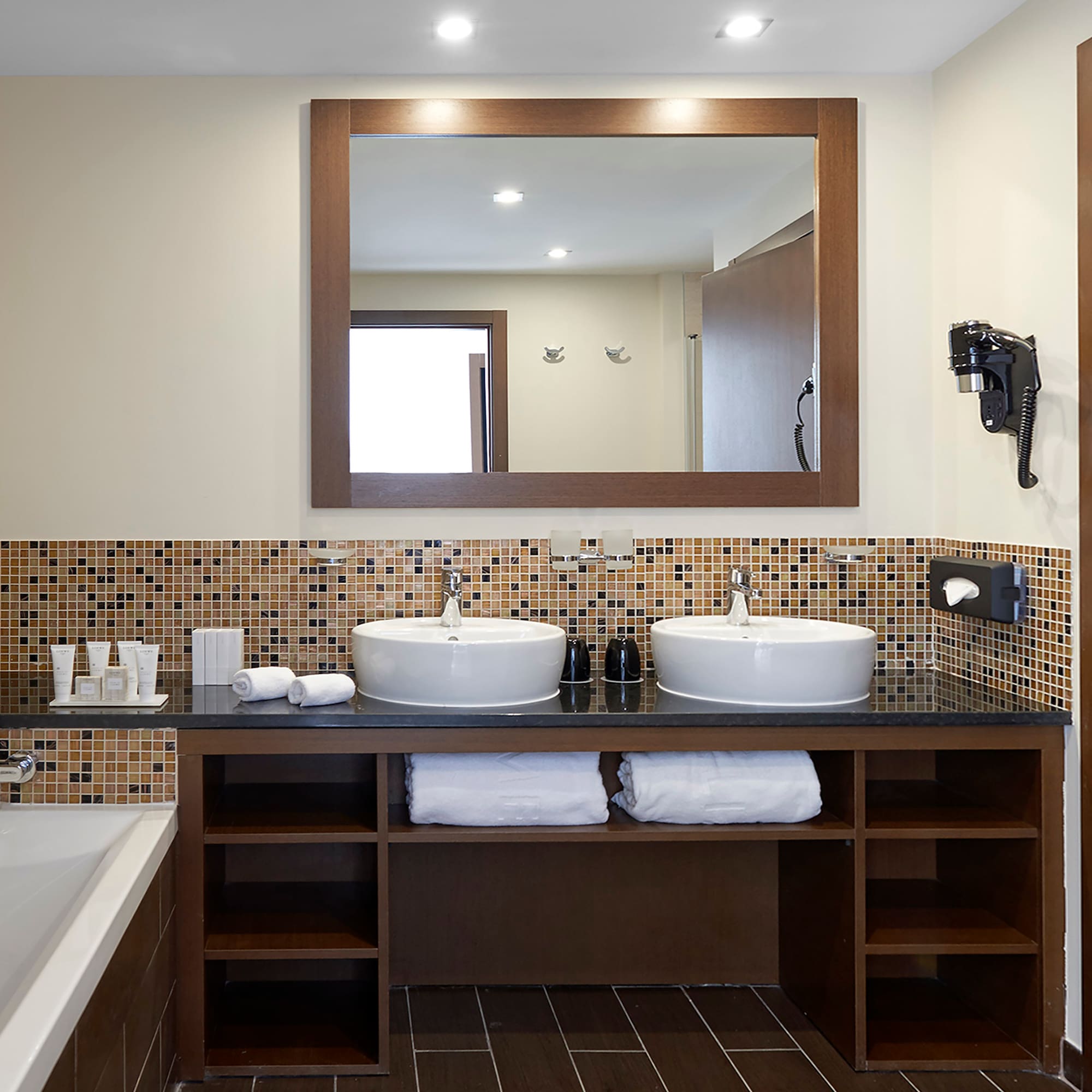 a bathroom with a mirror and sinks