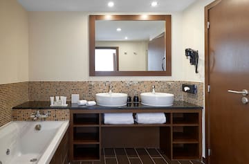 a bathroom with a mirror and sinks
