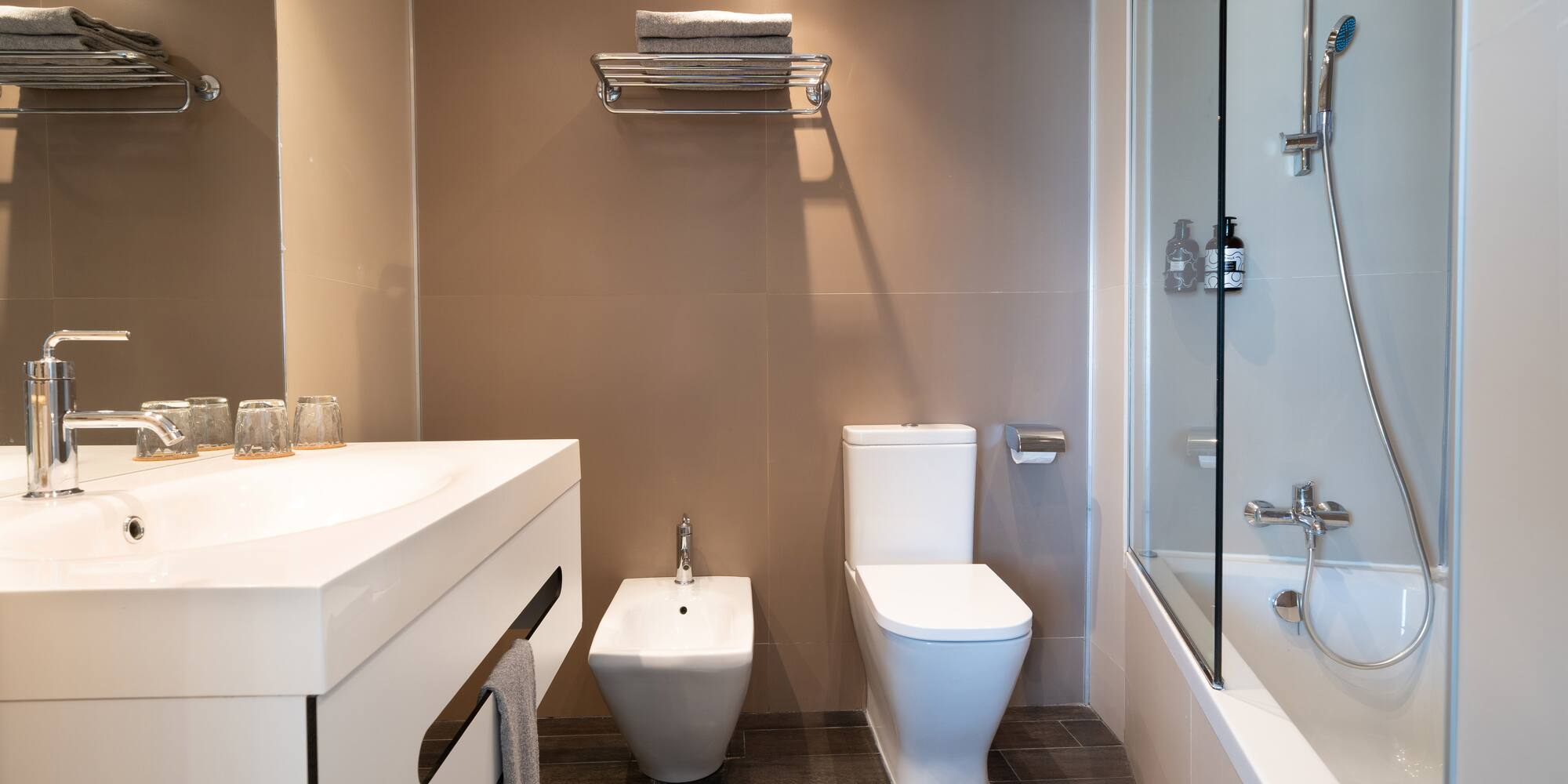 a bathroom with a shower and sink