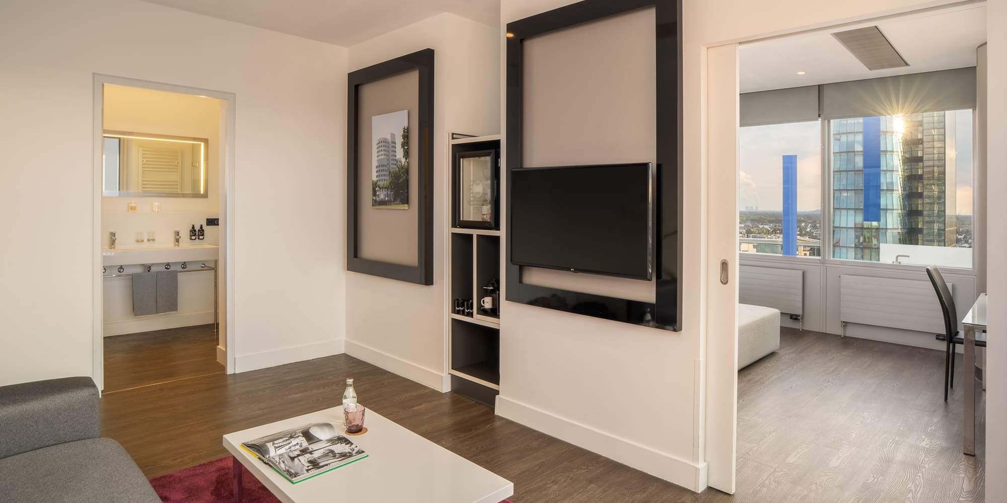 a living room with a tv on the wall