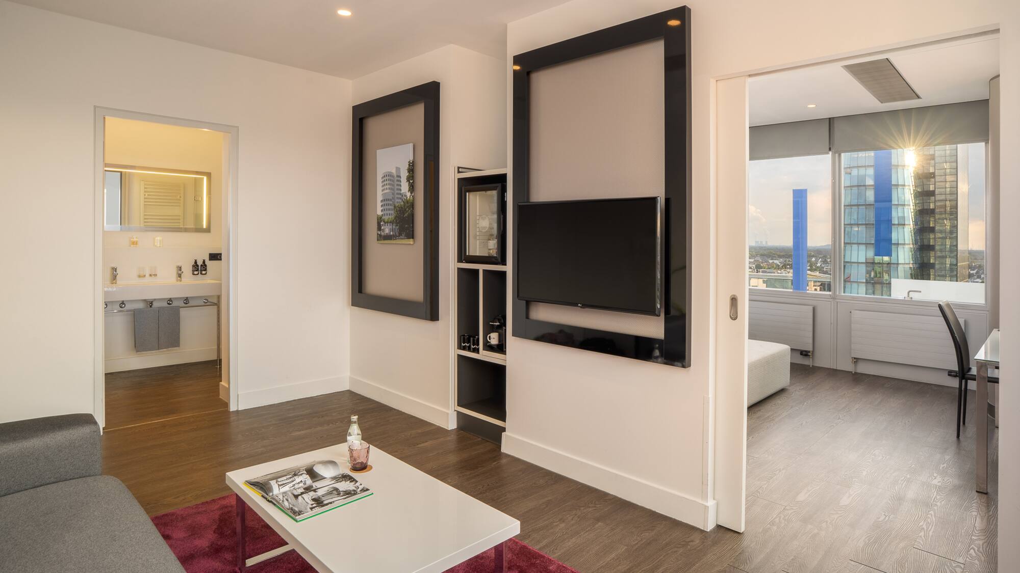 a living room with a tv on the wall
