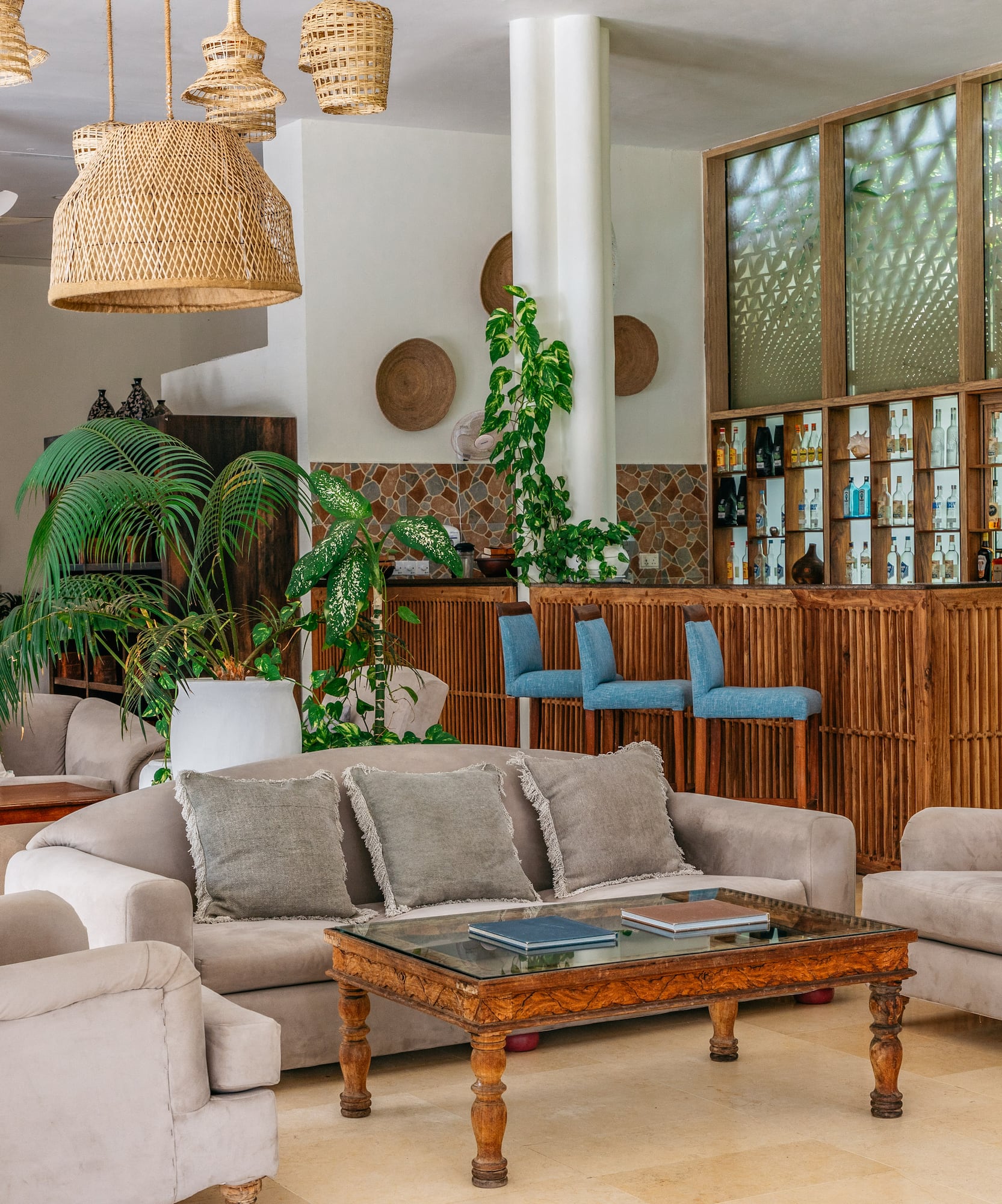 a room with a bar and furniture