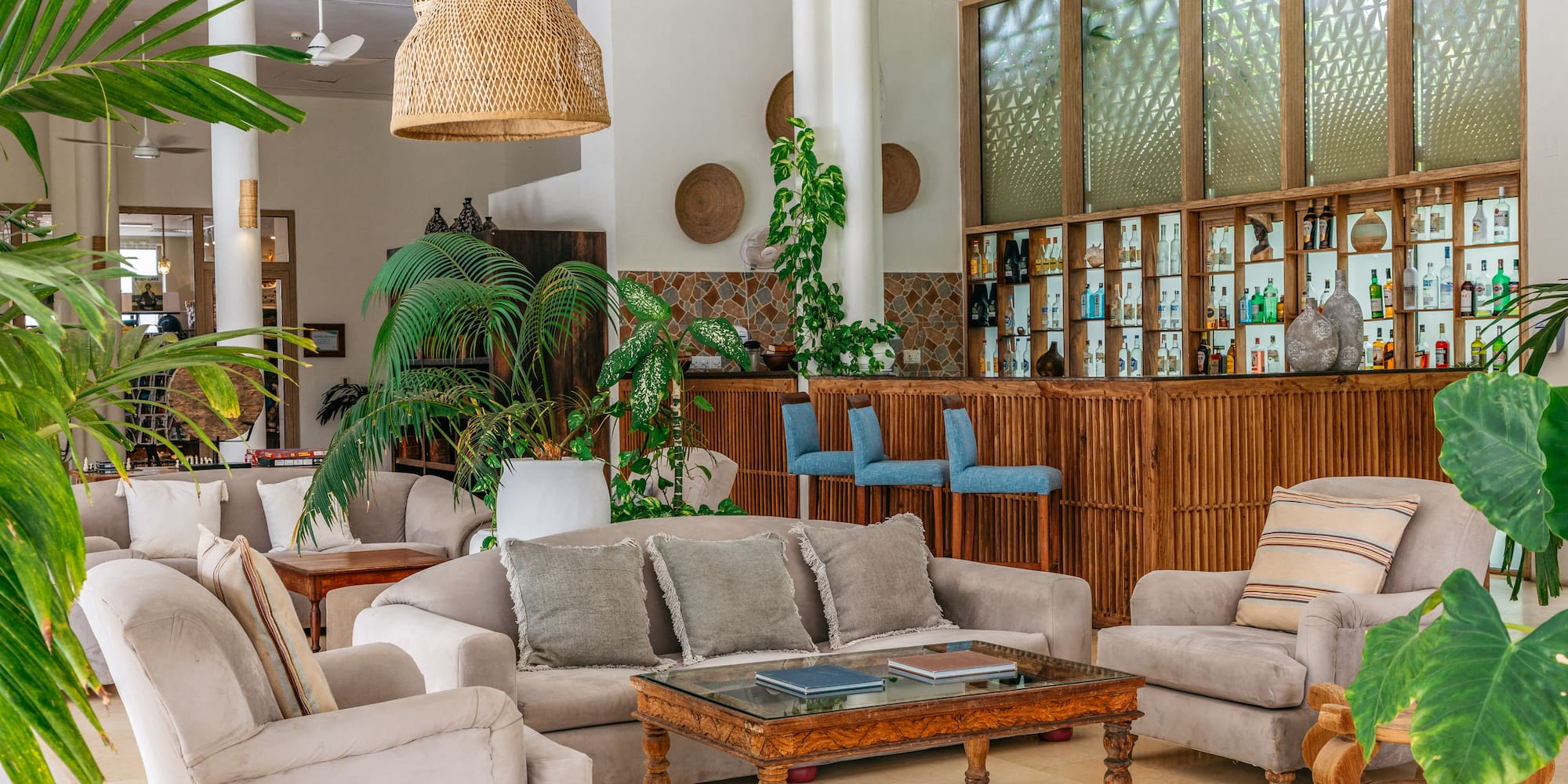 a room with a bar and furniture