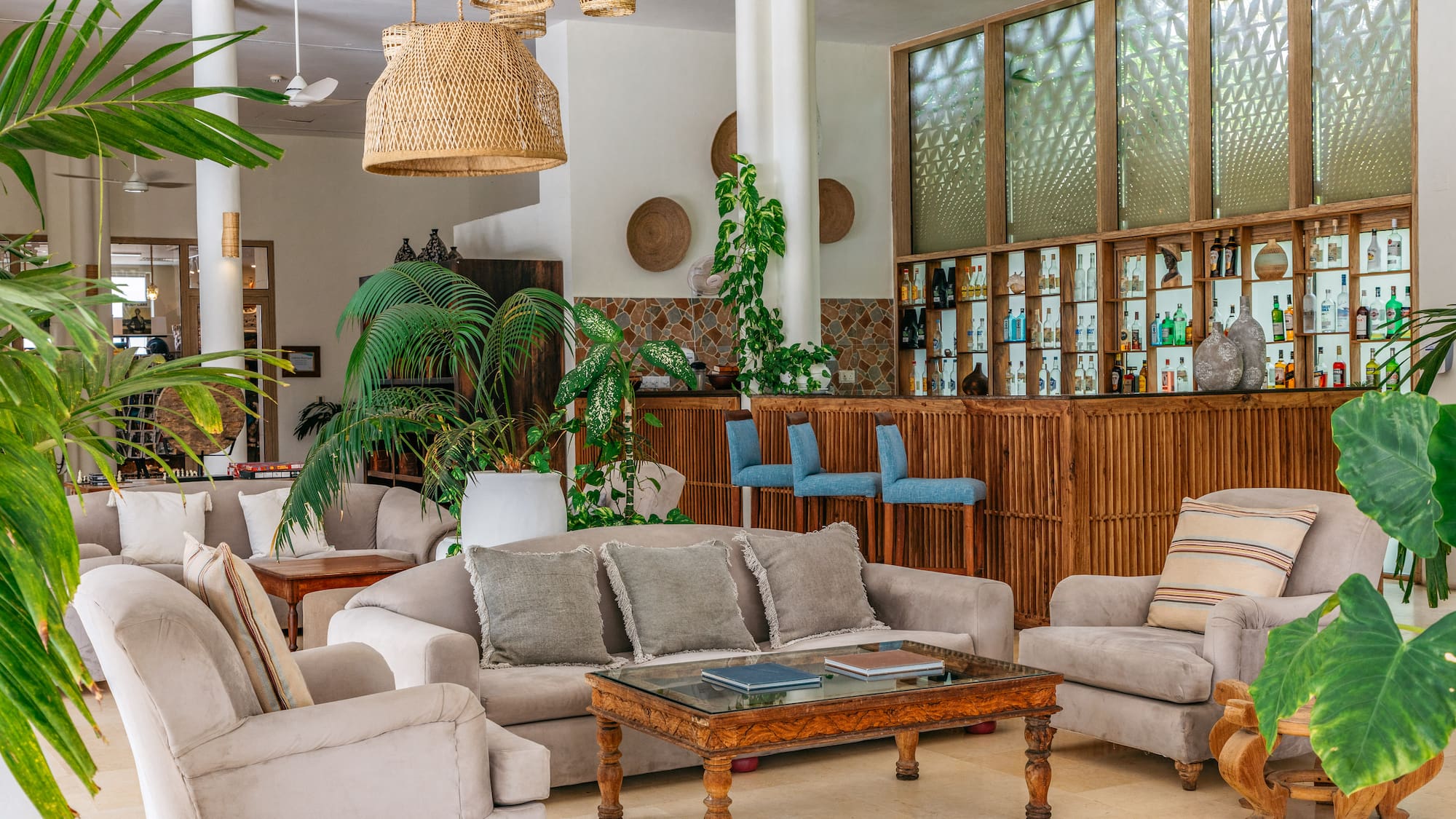 a room with a bar and furniture