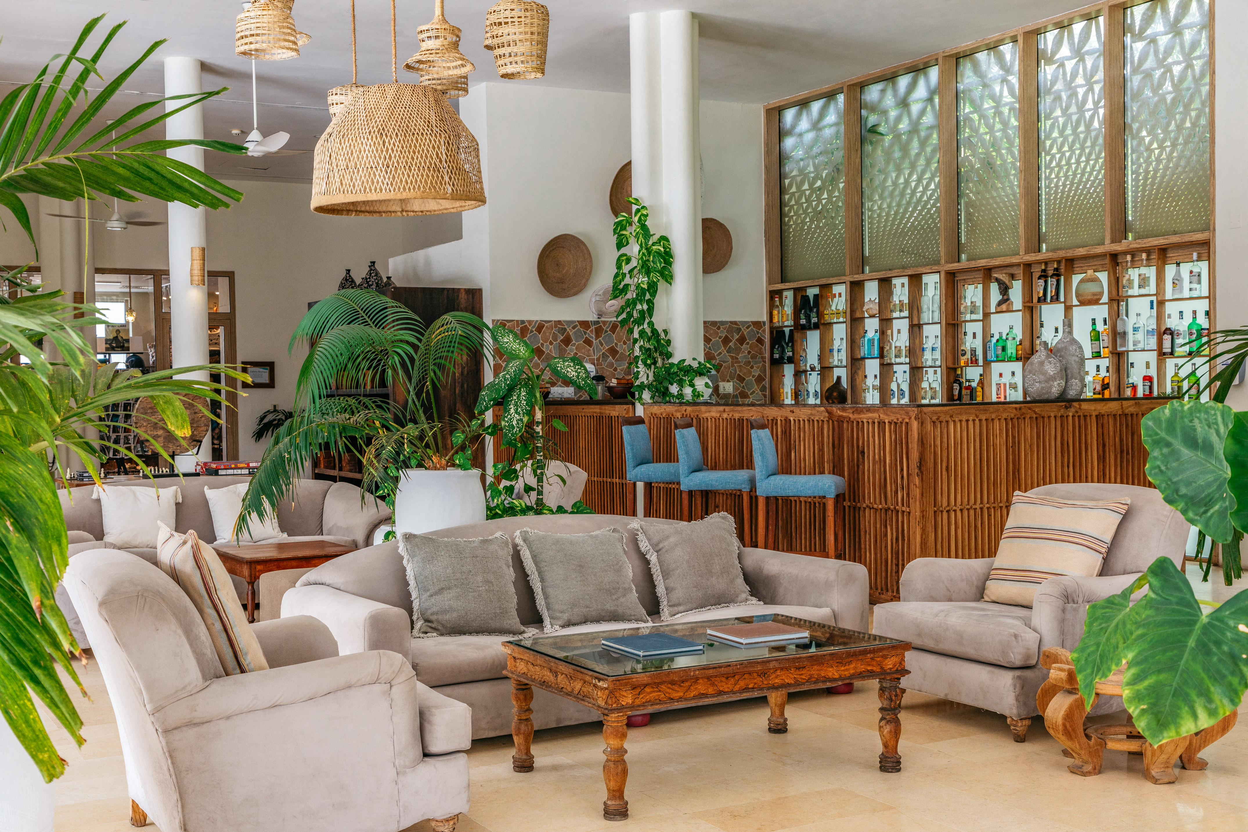 a room with a bar and furniture