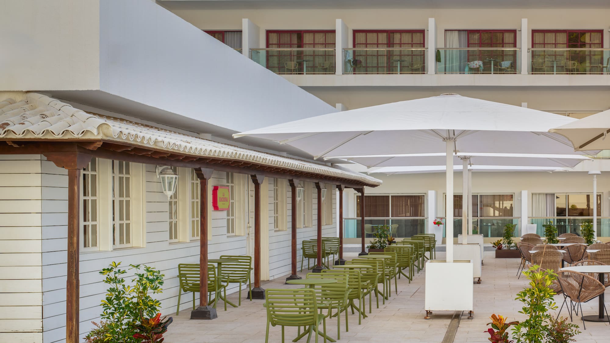 a patio with chairs and umbrellas