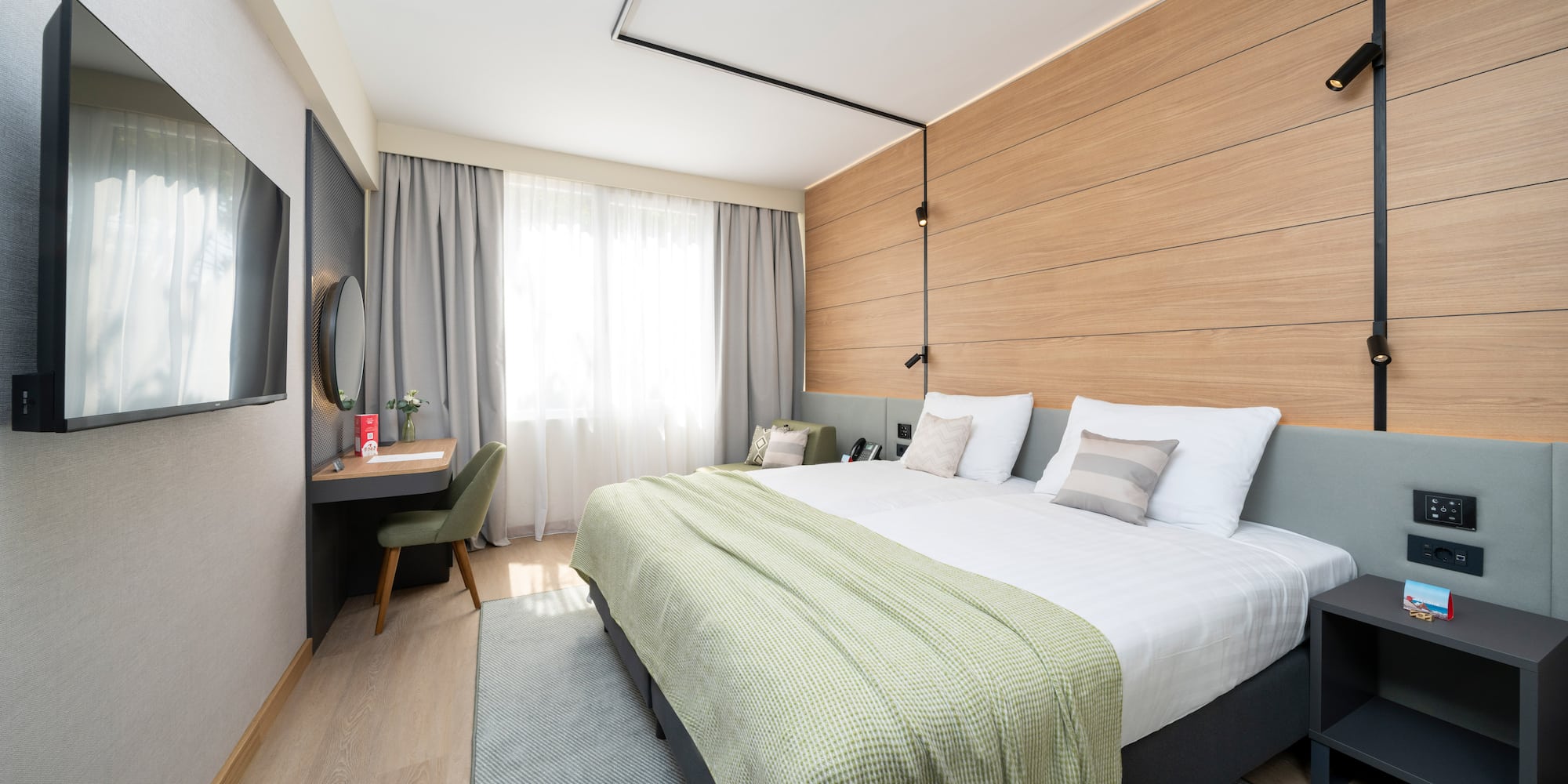 a room with a bed and a desk