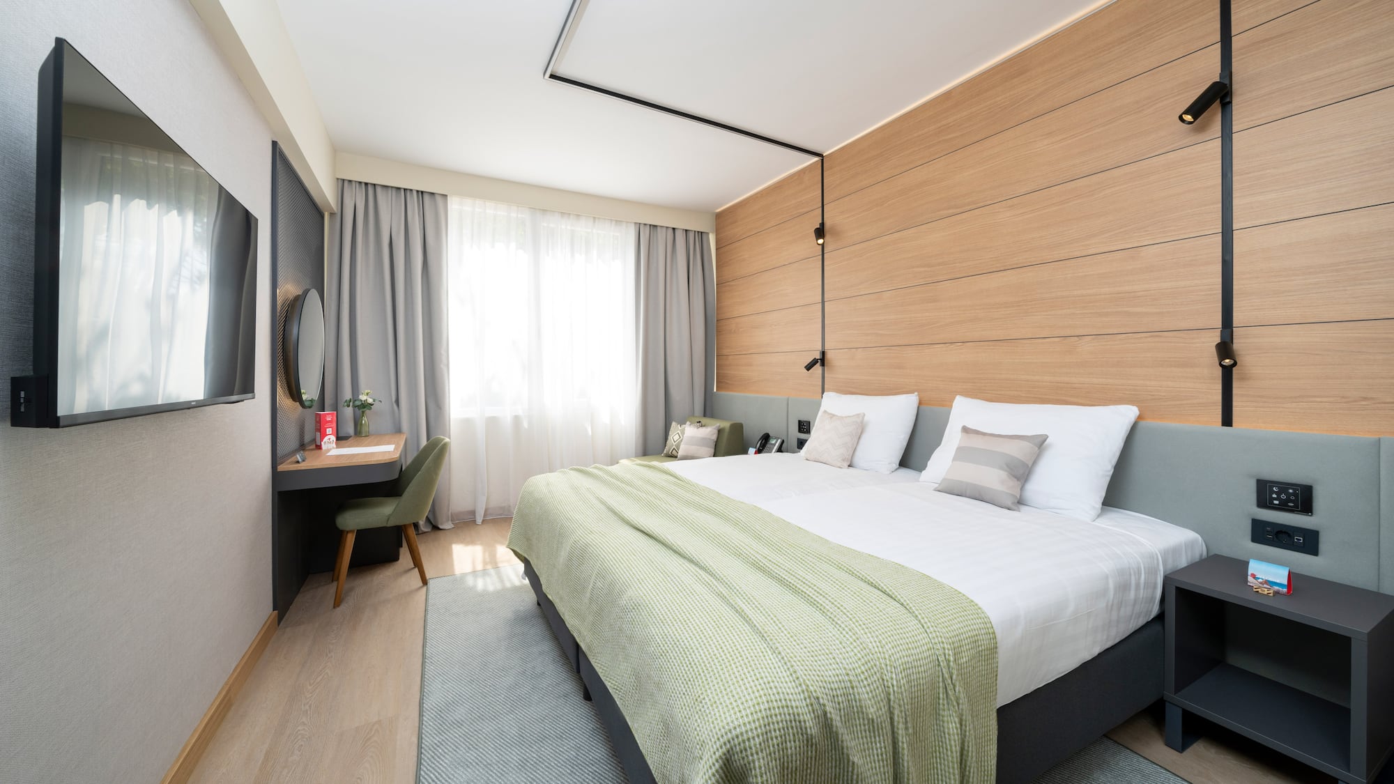 a room with a bed and a desk