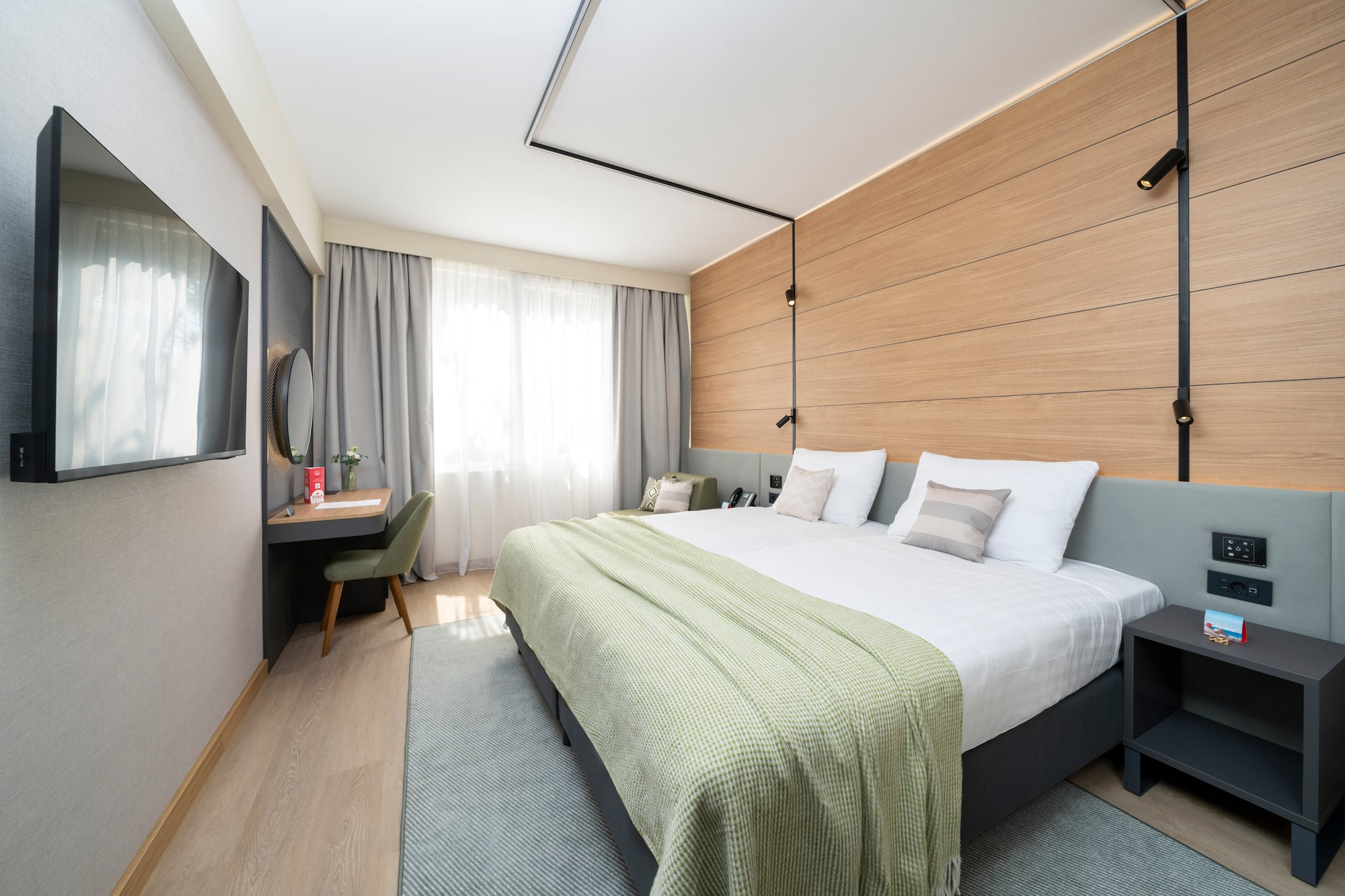 a room with a bed and a desk