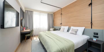 a room with a bed and a desk